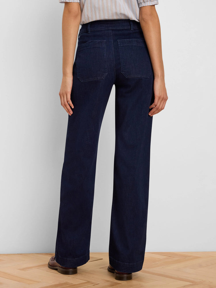 Dark blue wide leg jeans, shown from back, with two rectangular patch pockets on the rear.