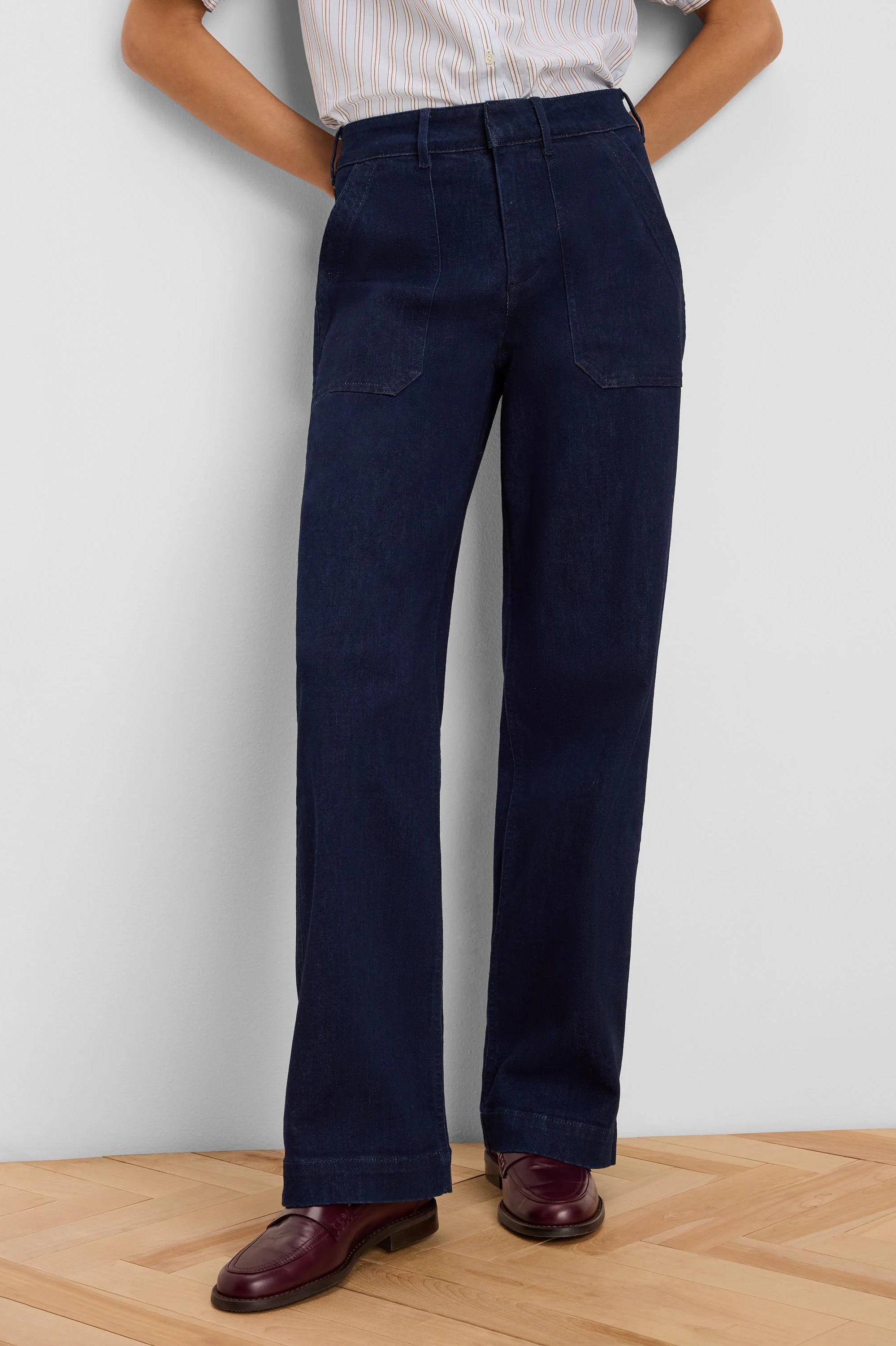 Dark blue, high-waisted, wide leg jeans with front patch pockets.