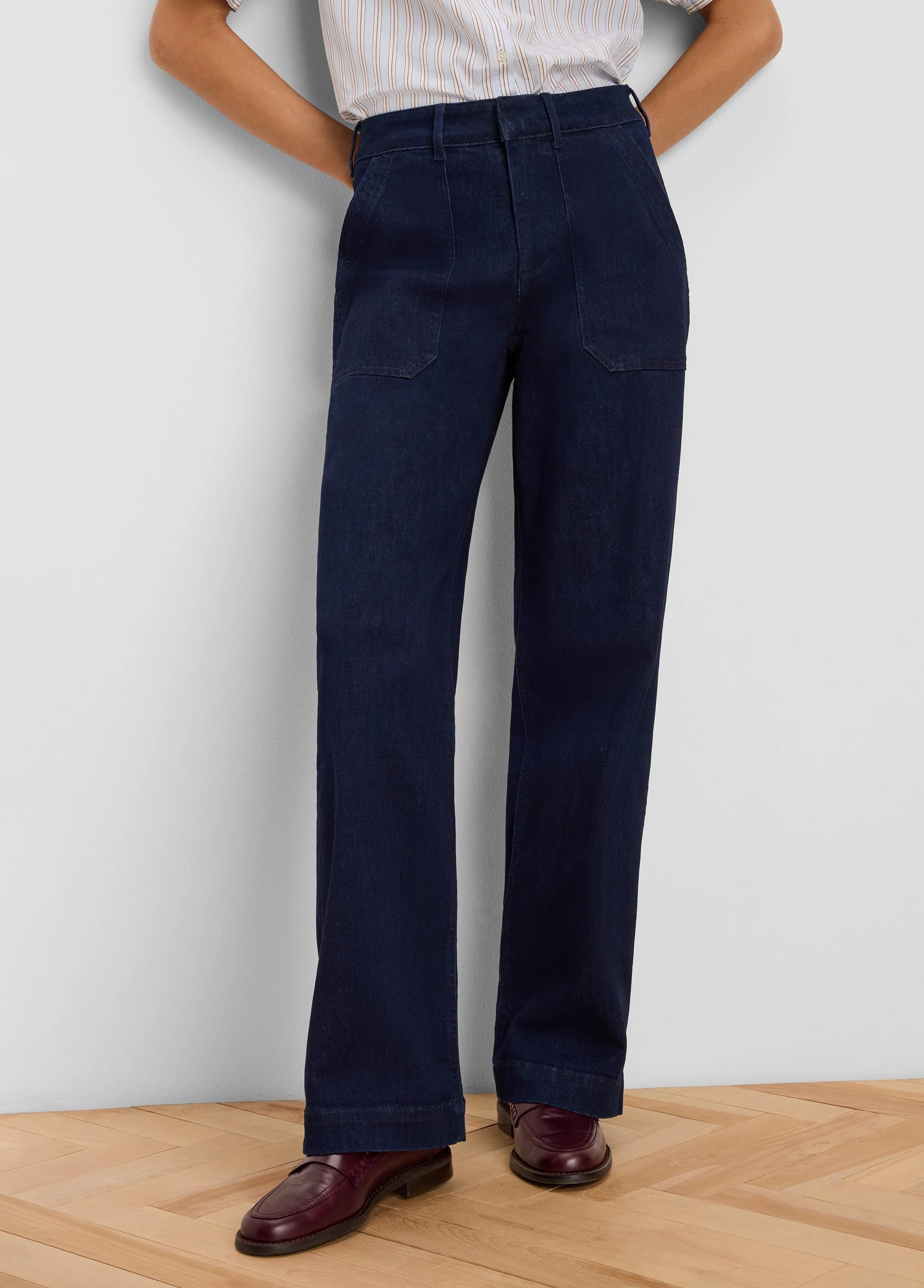 Dark blue, high-waisted, wide leg jeans with front patch pockets.