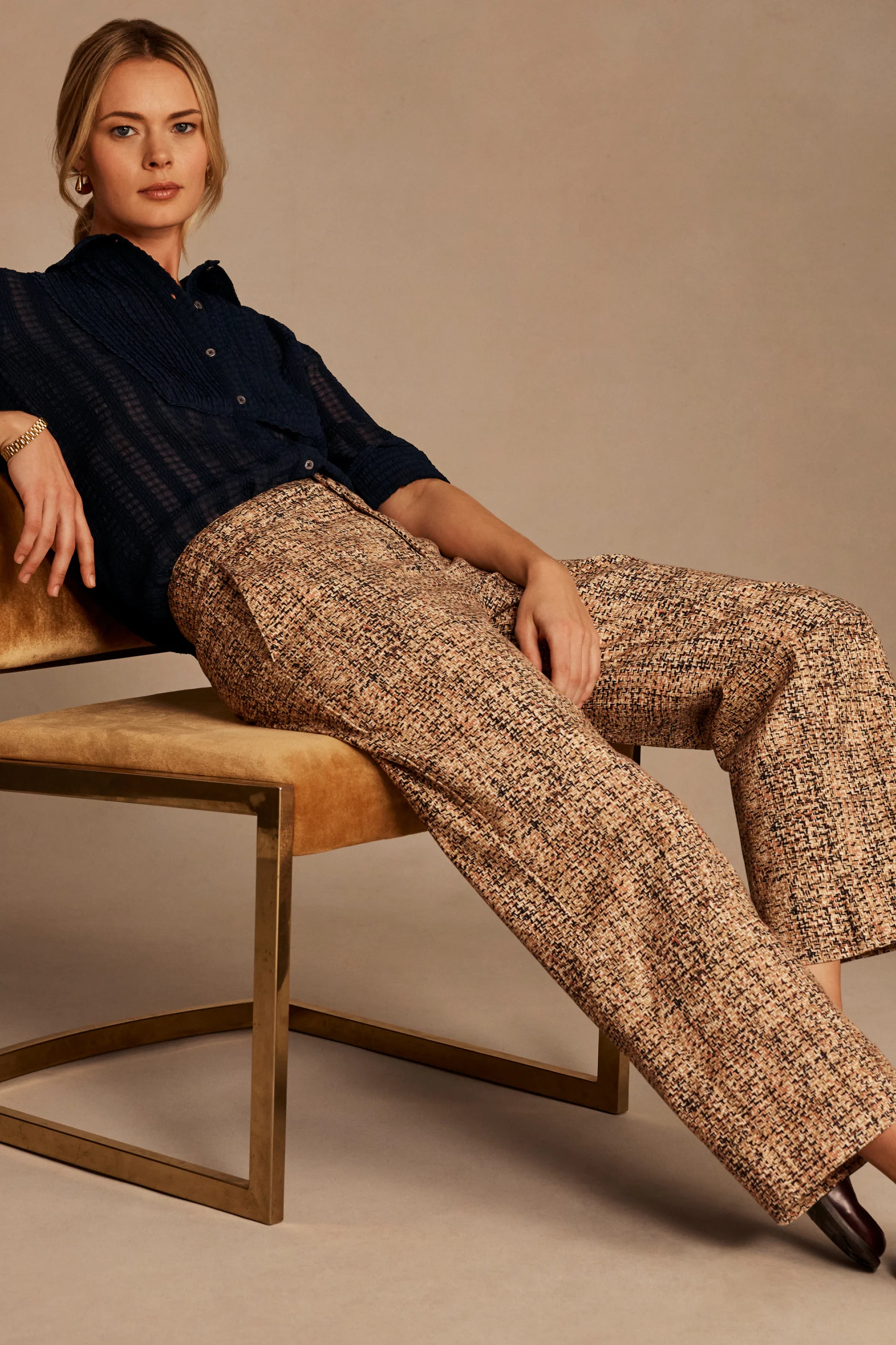 Beige, brown, black tweed cuffed ankle pants with a wide-leg cut.