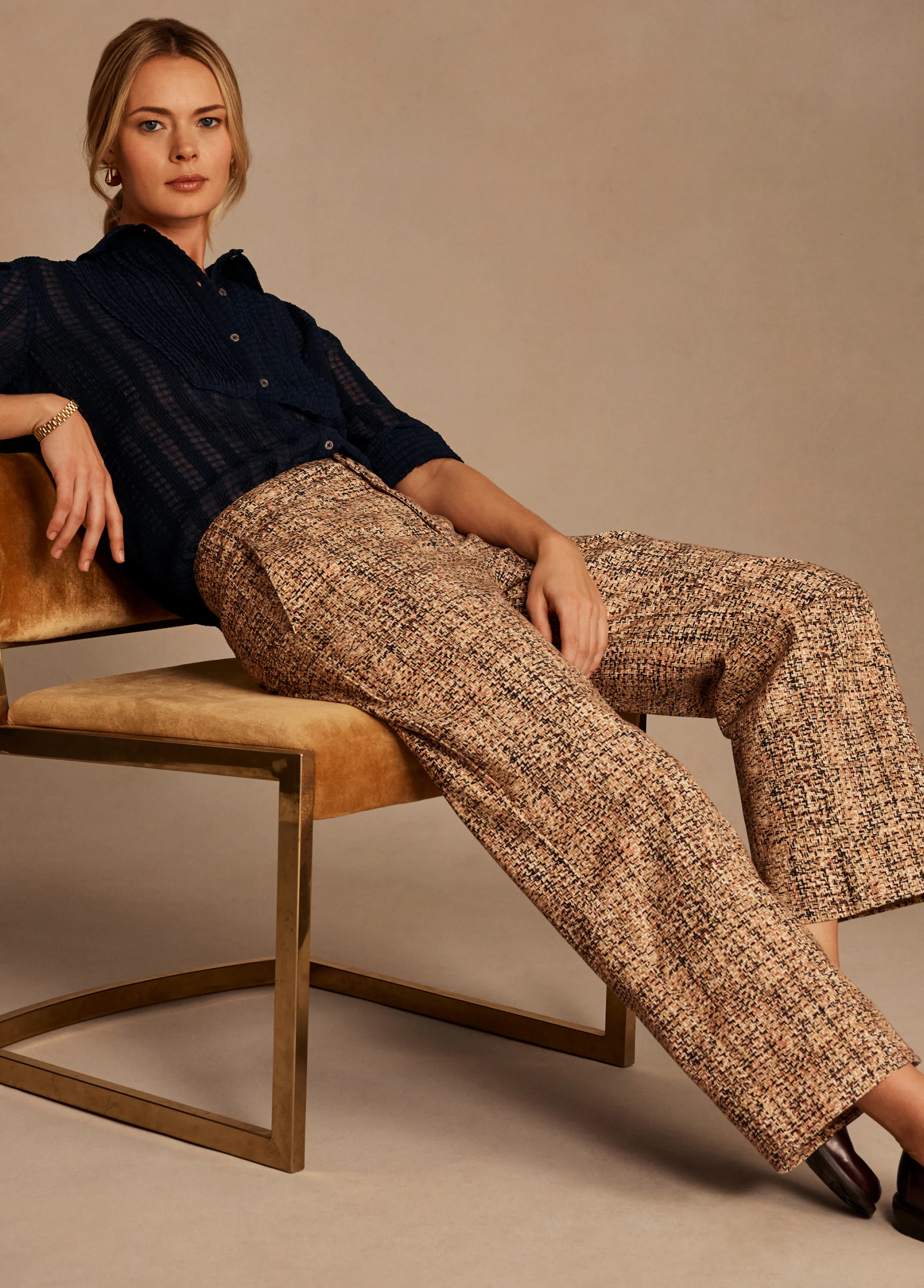 Beige, brown, black tweed cuffed ankle pants with a wide-leg cut.