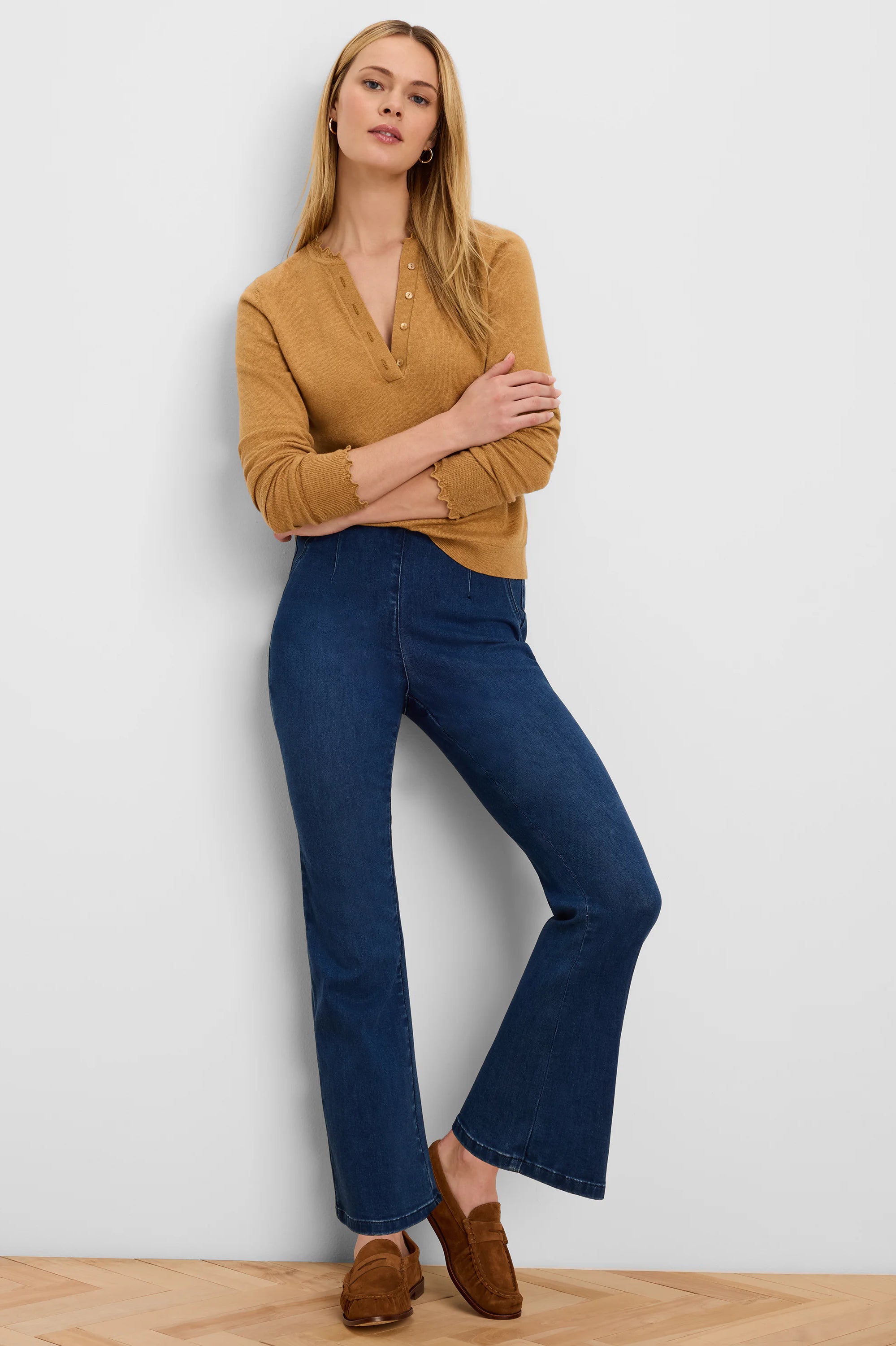High-waisted, dark indigo bootcut jeans with a front seam.