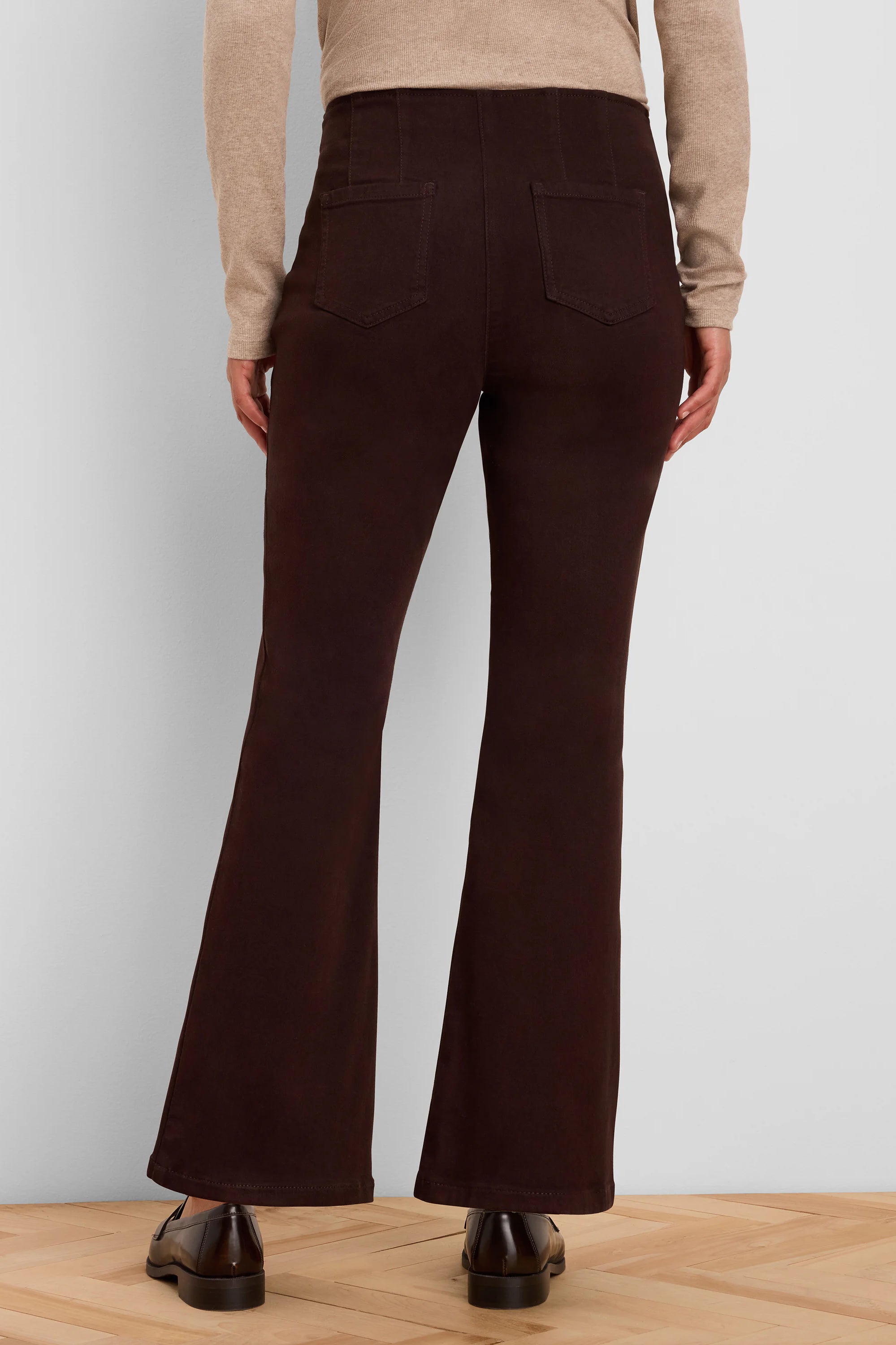 Dark brown boot-cut jeans, back view with visible back pockets and a flared leg opening.