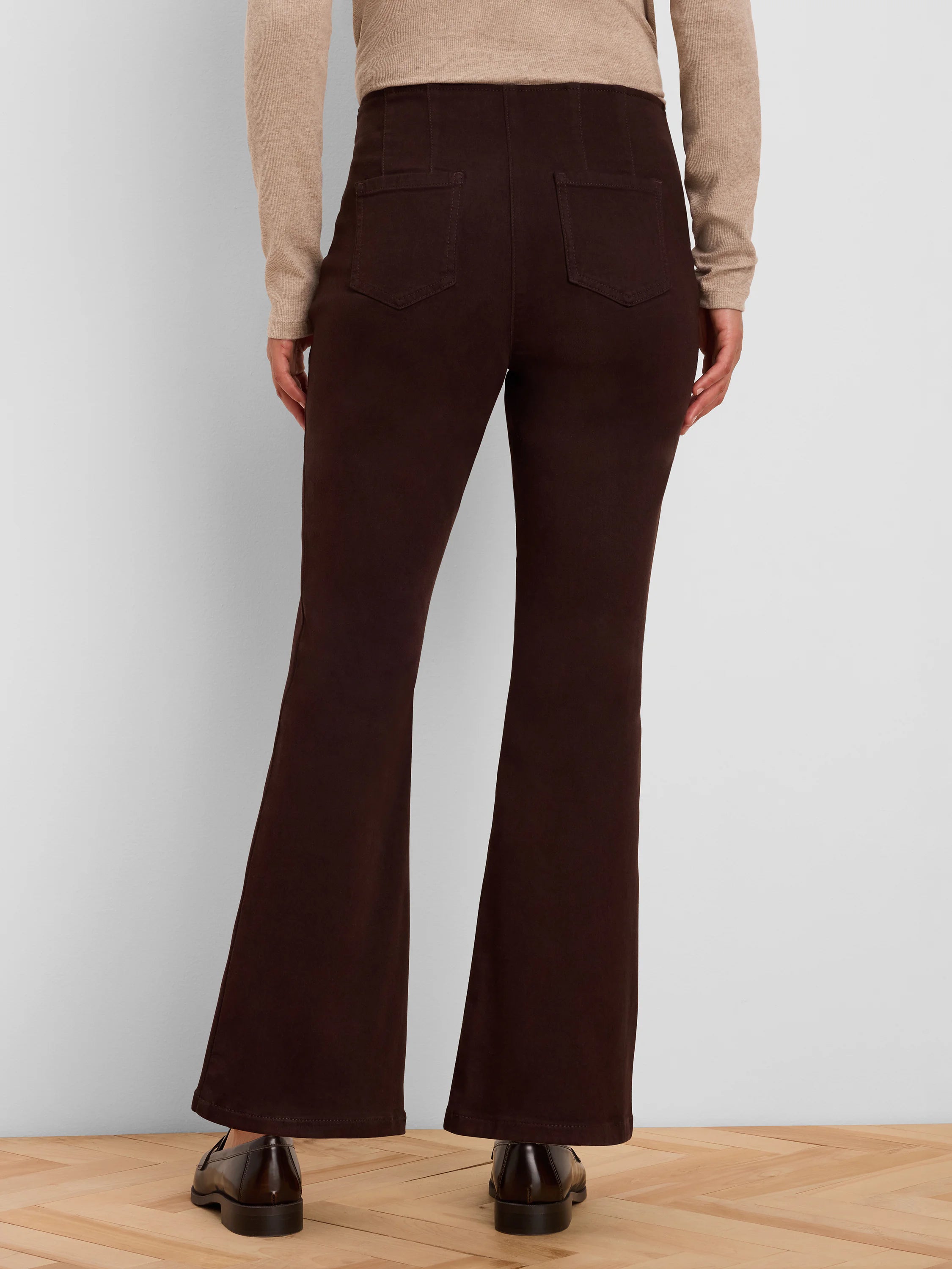 Dark brown boot-cut jeans, back view with visible back pockets and a flared leg opening.