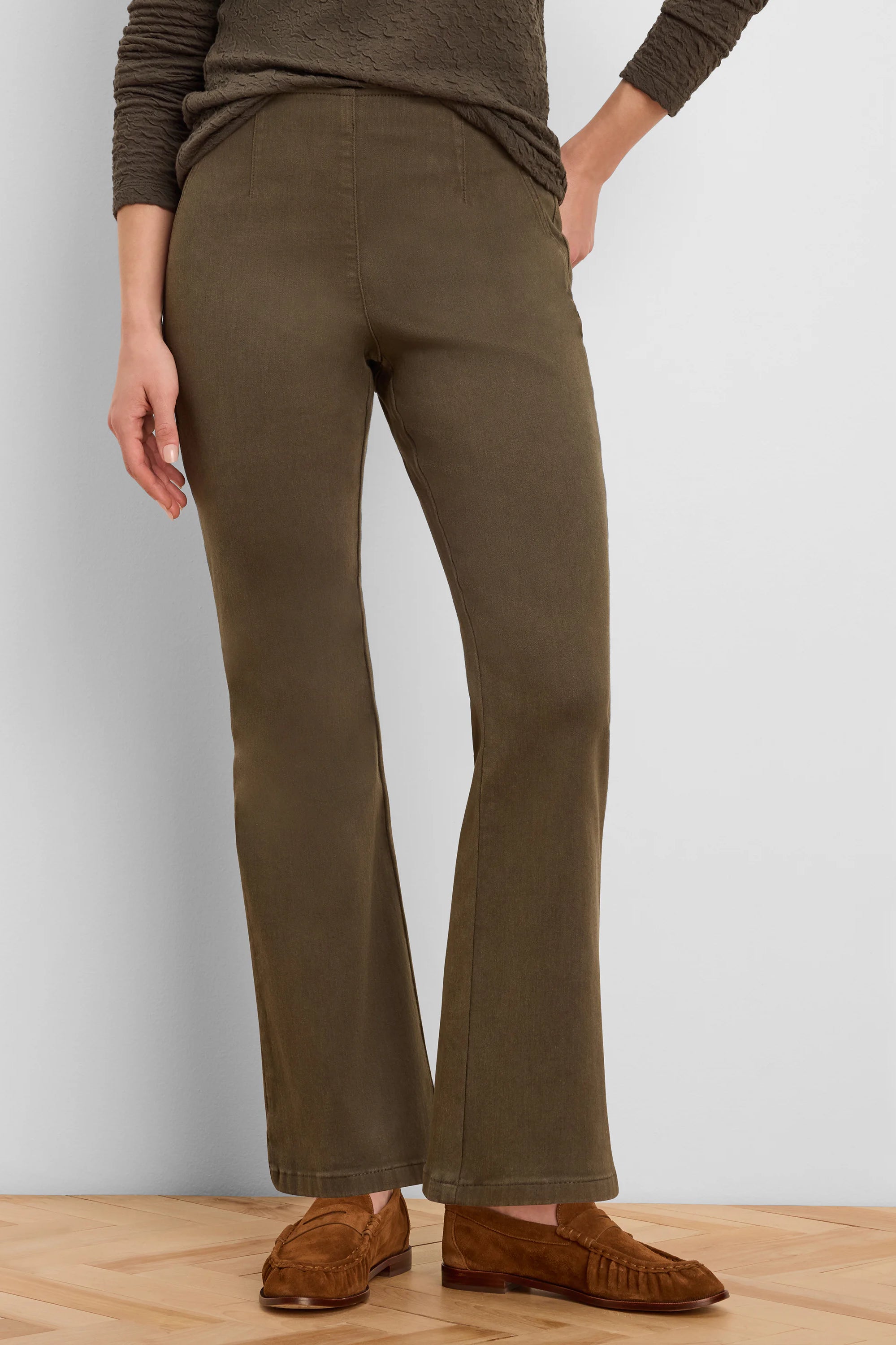 Dark olive green bootcut jeans with a high, smooth waist and vertical front leg seams.