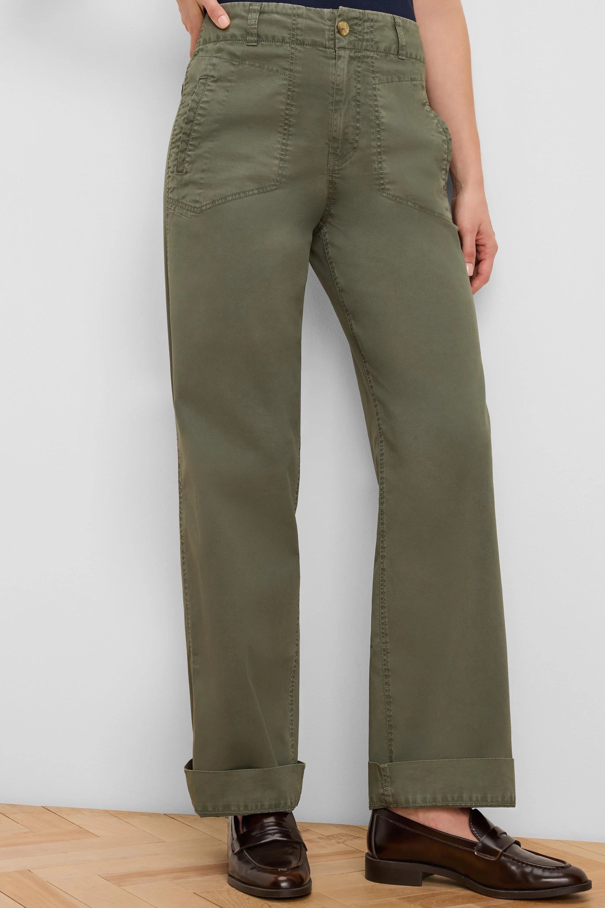 Olive green relaxed fit pants with angled patch pockets, button, and cuffed hem.