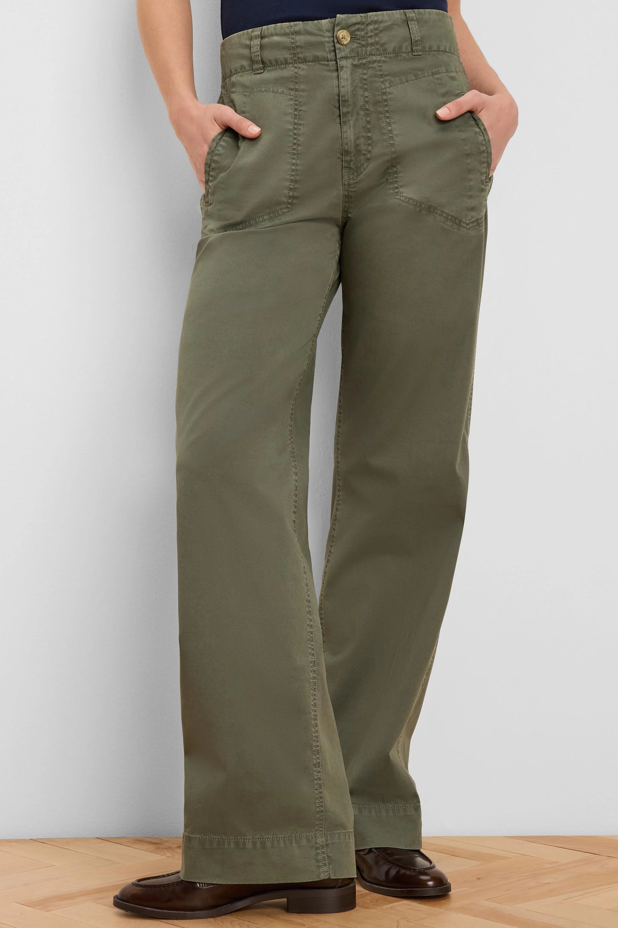 Khaki green wide-leg pants with angled front patch pockets, a high waist, and visible utility stitching.