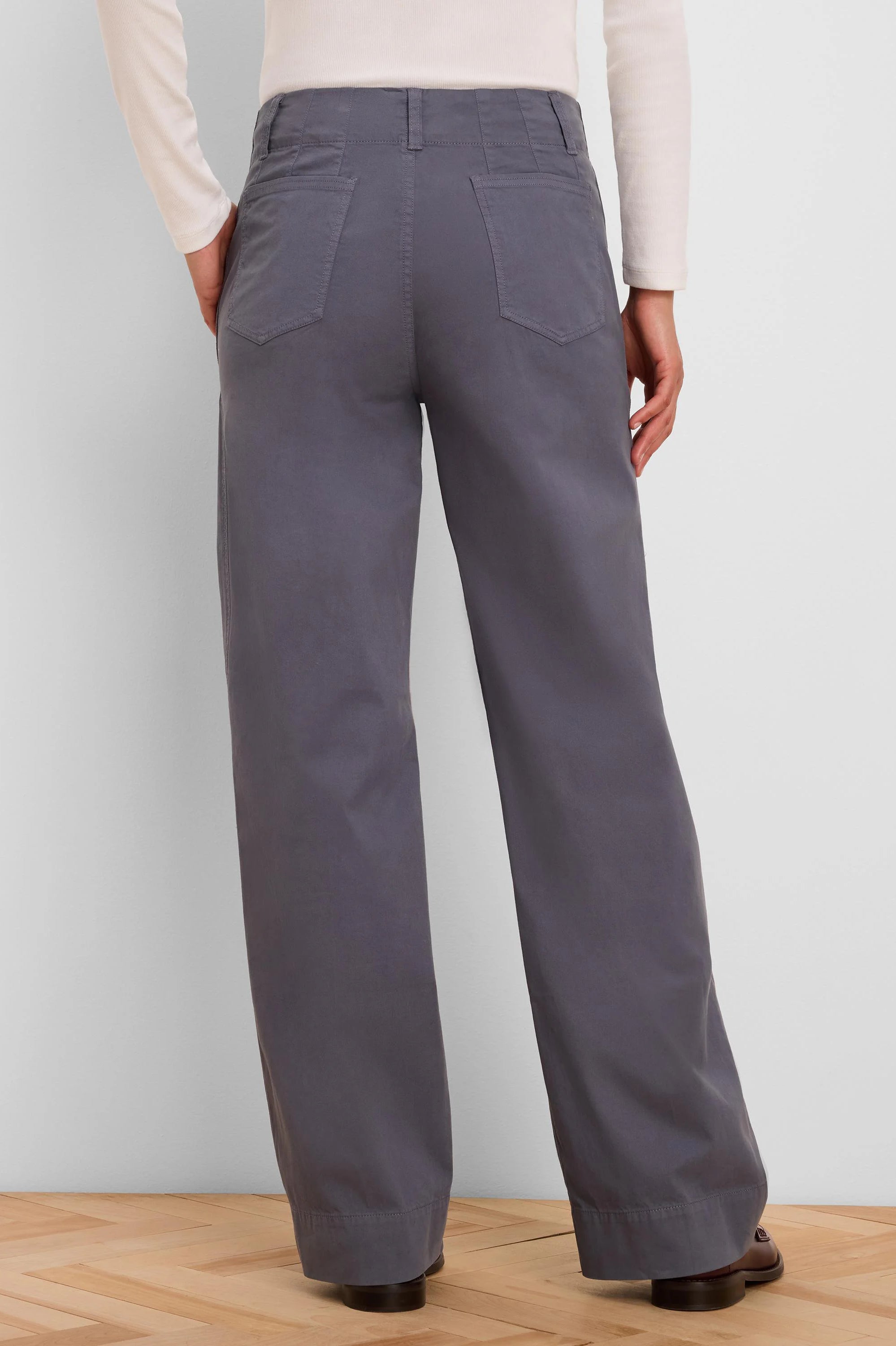 Dark grey wide-leg pants, high-waisted with angled back pockets. Back view.