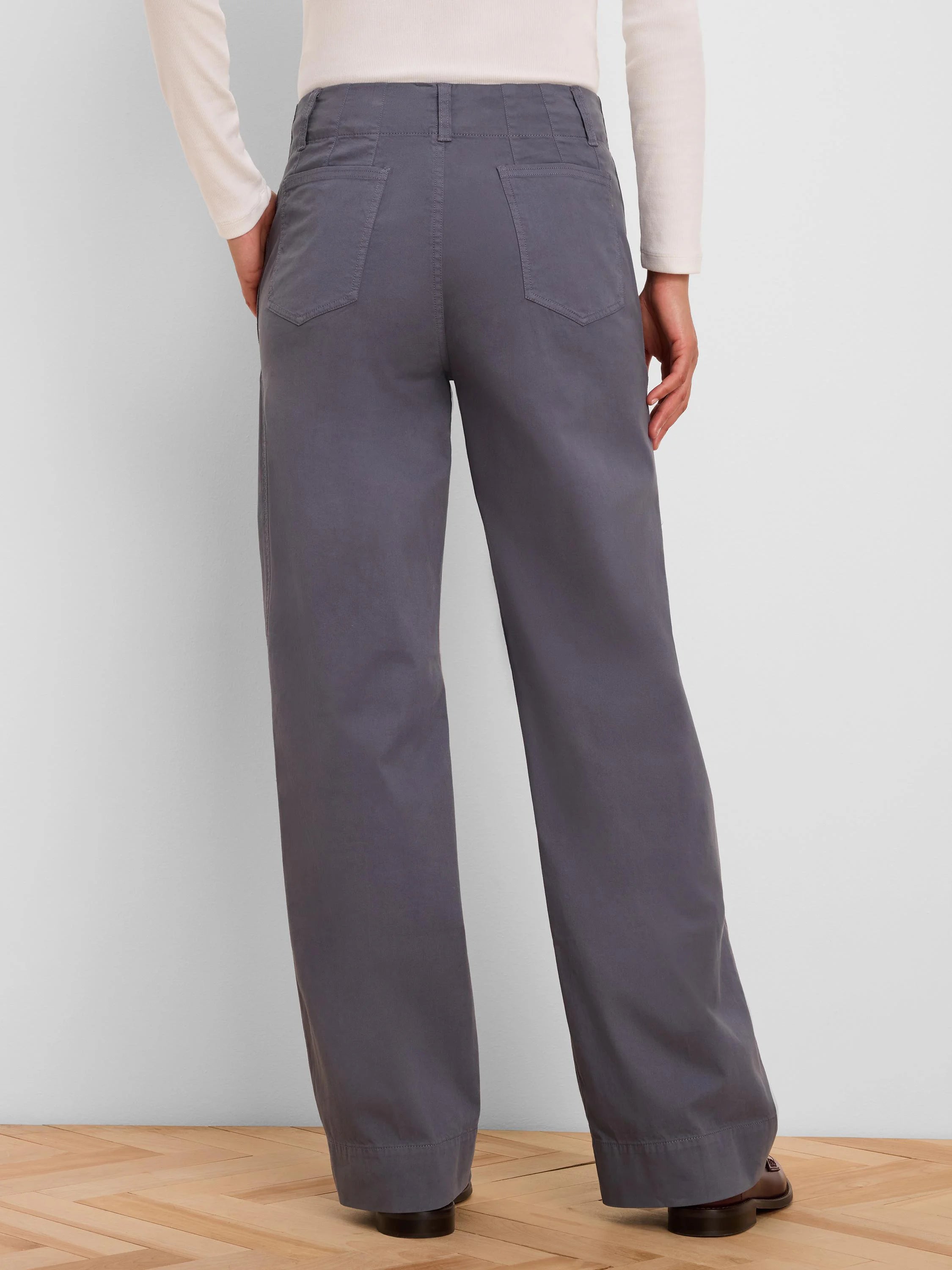 Dark grey wide-leg pants, high-waisted with angled back pockets. Back view.