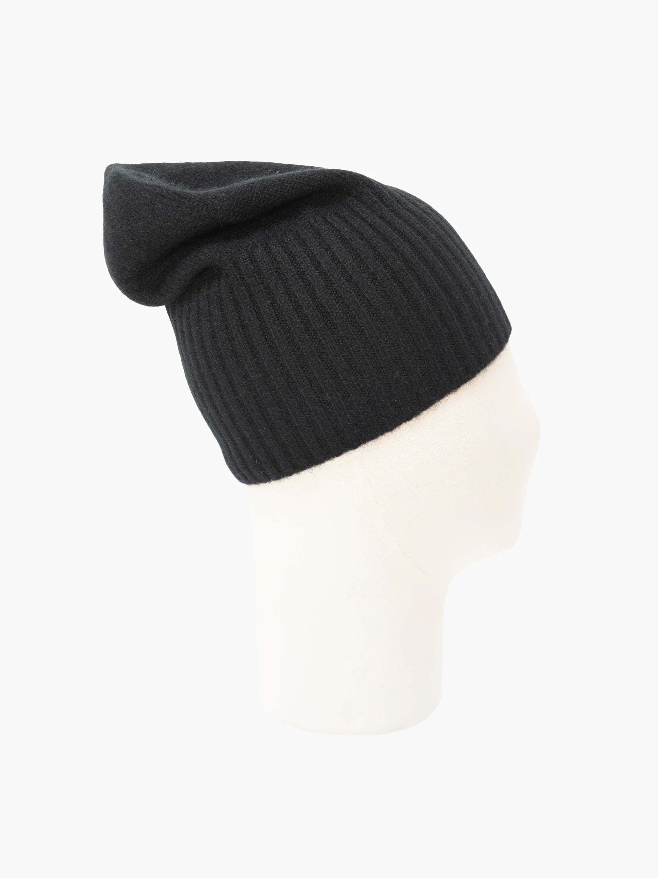 Black cashmere flat hat, finely ribbed, with a folded brim, displayed on a white mannequin head.