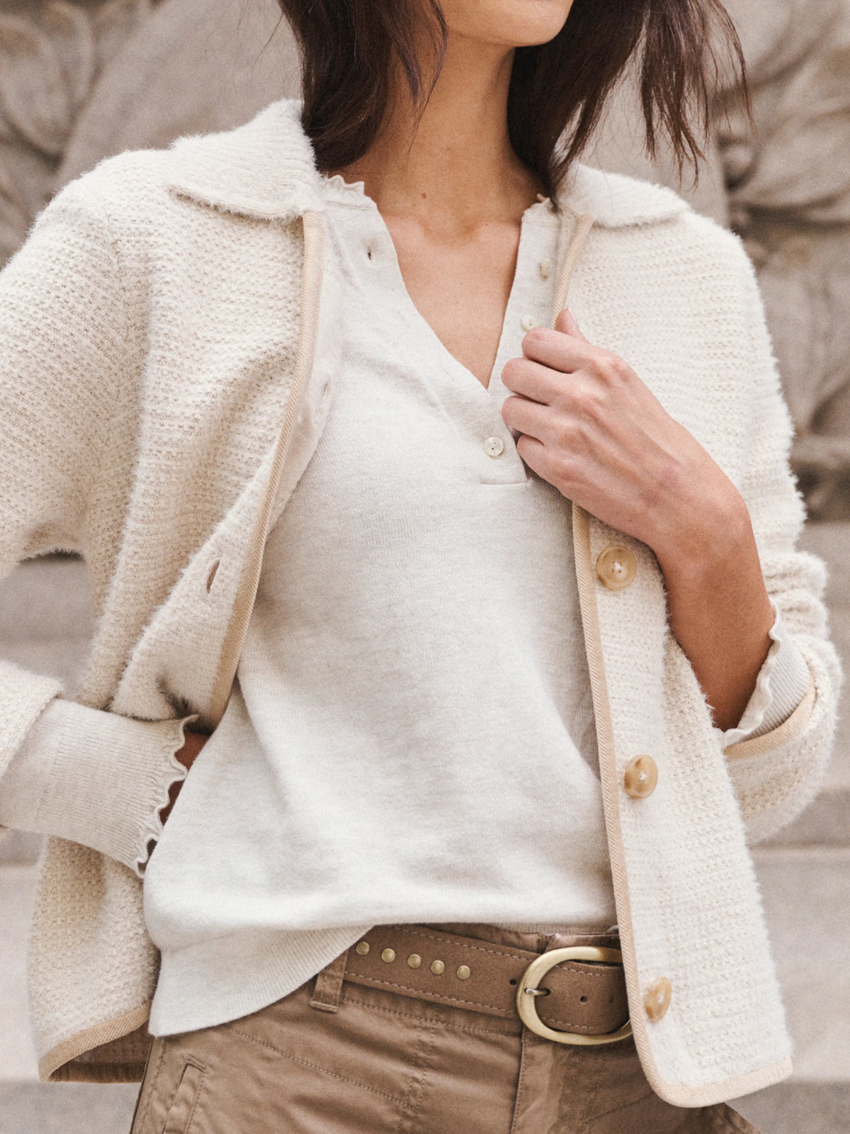 Brown suede studded belt with a gold oval buckle.