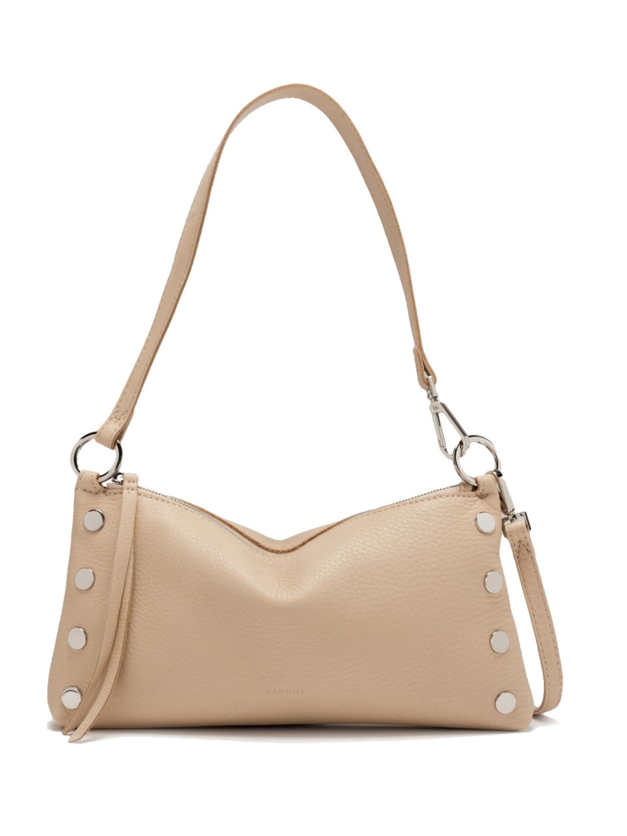 Light beige pebbled leather Hammitt Kyle bag, V-shaped top, silver stud details, and a single shoulder strap.
