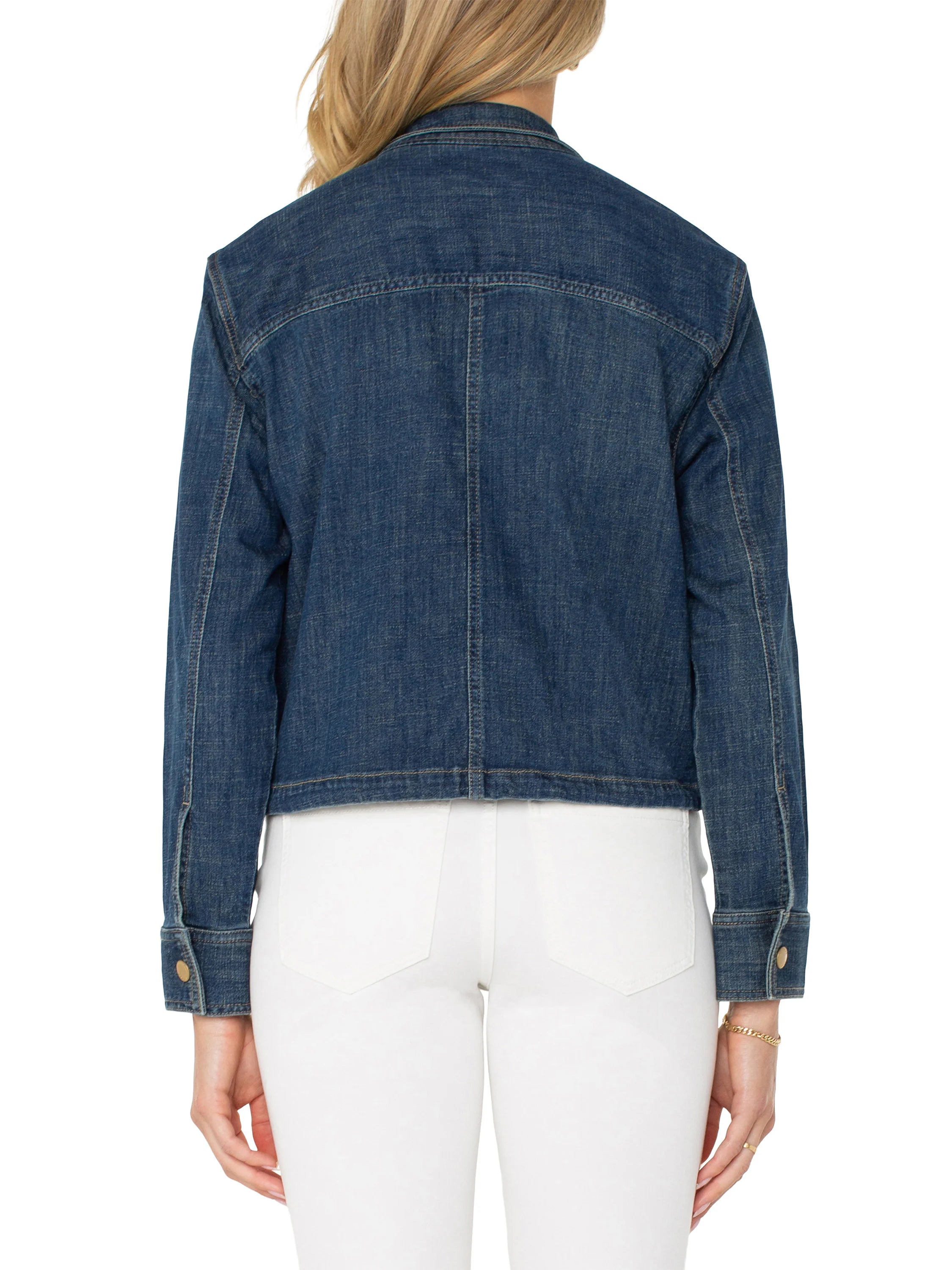 Back view of a dark blue denim cropped jacket. Features visible seam stitching and gold-tone cuff buttons.