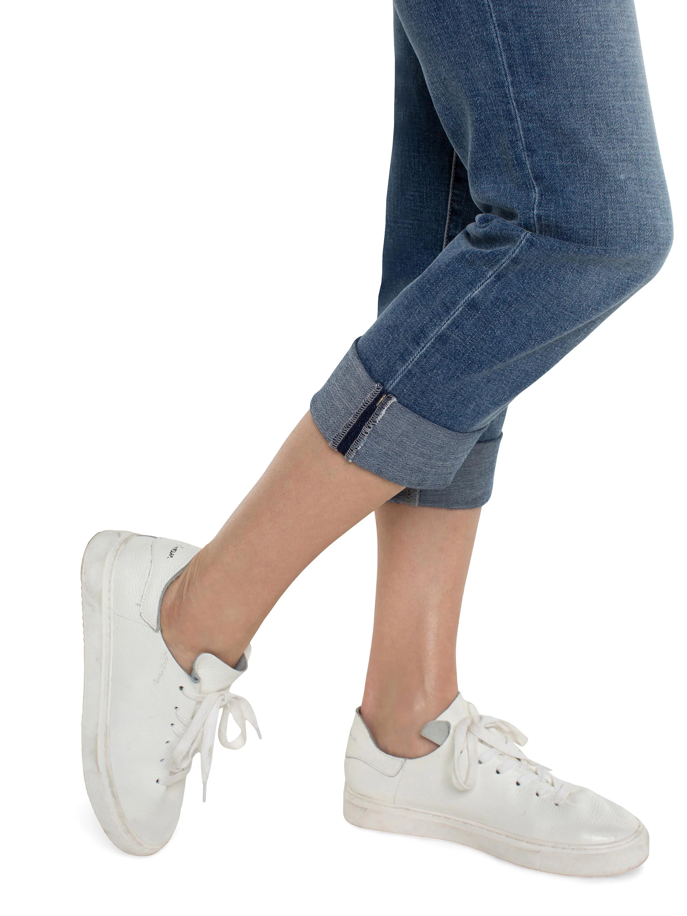 Medium blue cropped denim jeans with a rolled hem.