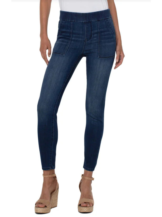Dark wash blue denim pull-on jeans with pockets; elastic waistband.