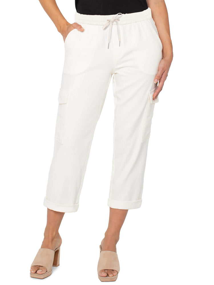 Off-white cropped cargo pants with drawstring waist and cuffed hems. Features side pockets.