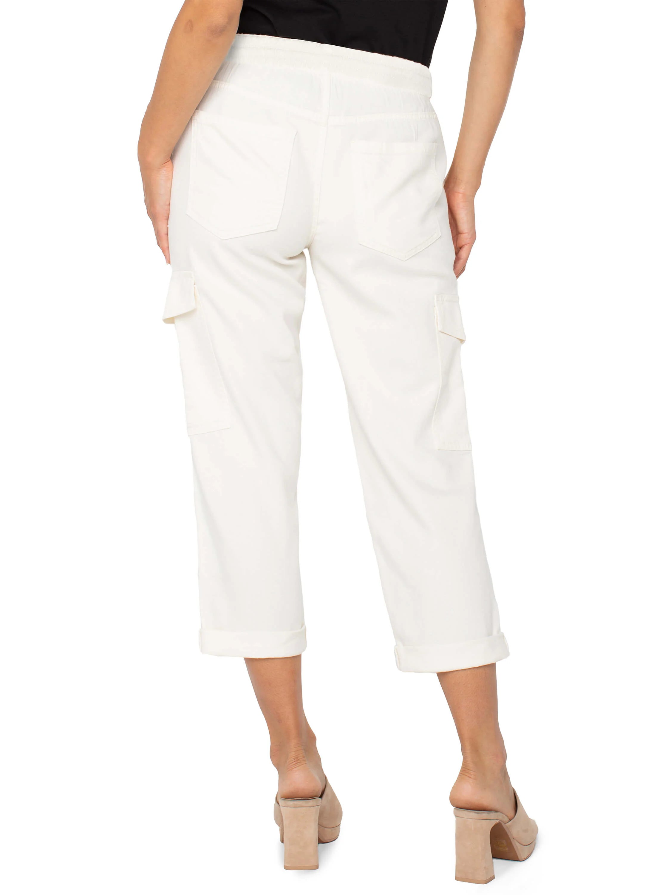 Off-white cropped cargo pants with cuffed hems and side pockets. Drawstring waist.