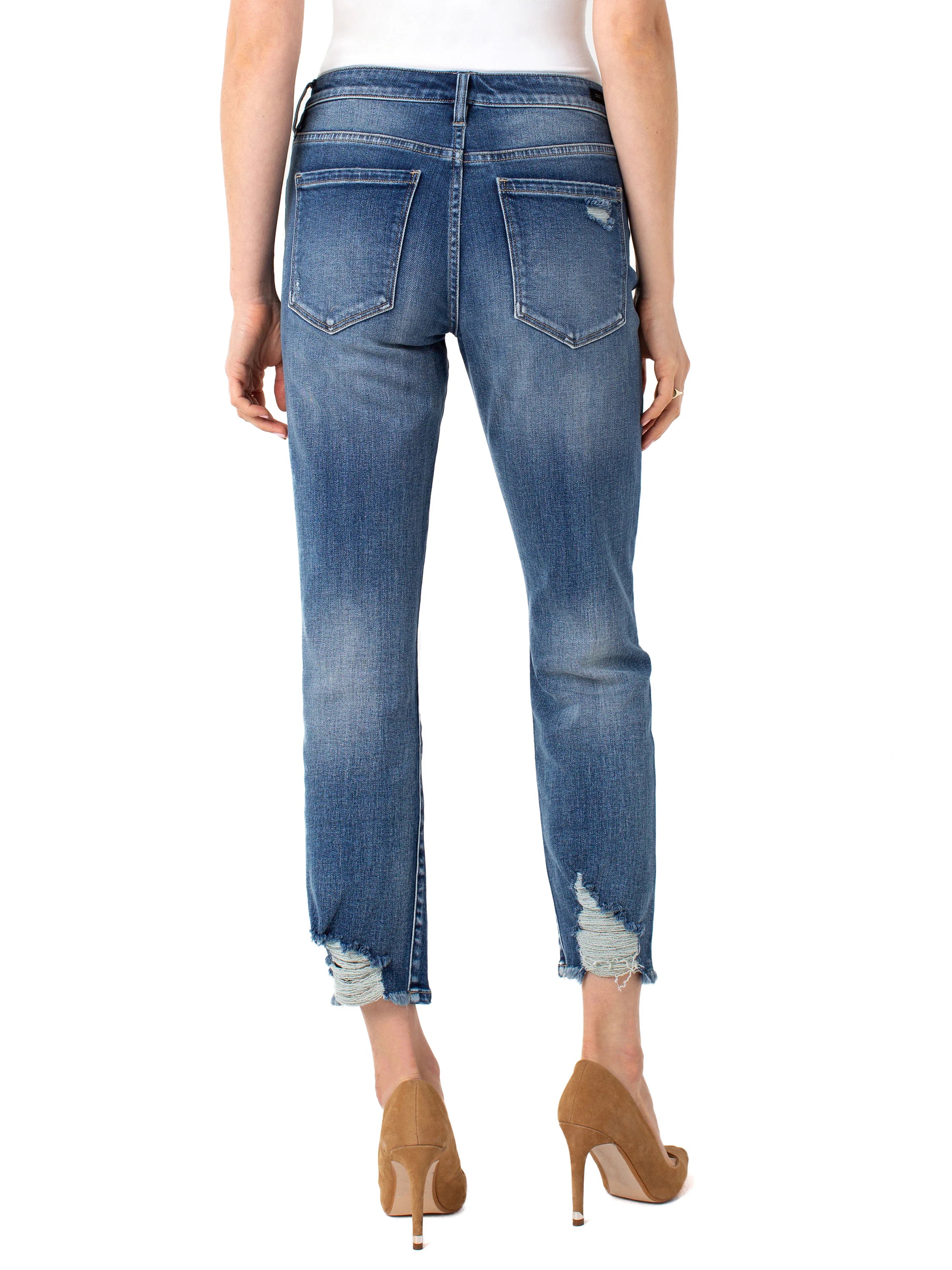 Here's alt text for the image, under 125 characters:
"Medium-wash blue denim jeans, cropped, slightly distressed at the...