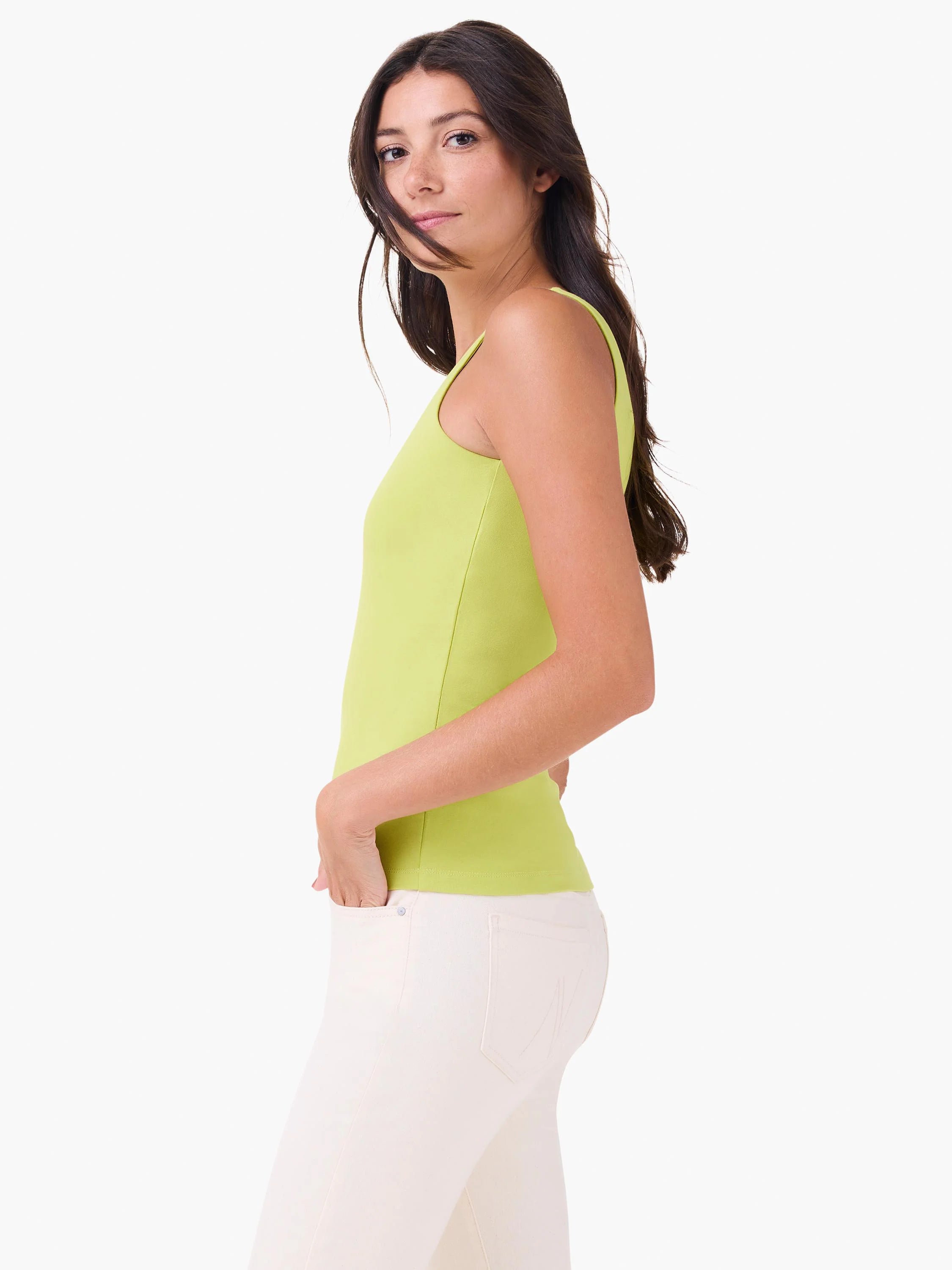 Lime green, sleeveless, form-fitting tank top worn by a woman, shown from the side.