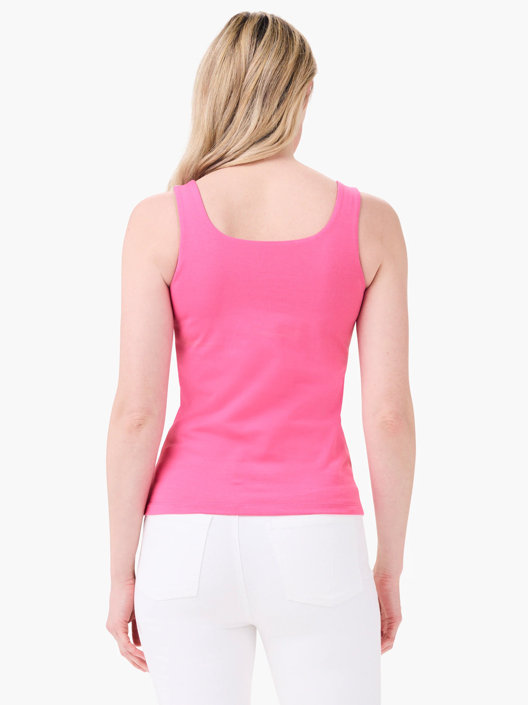 Rear view of a bright pink tank top on a model. It has wide straps and a scoop back neckline, fitted.