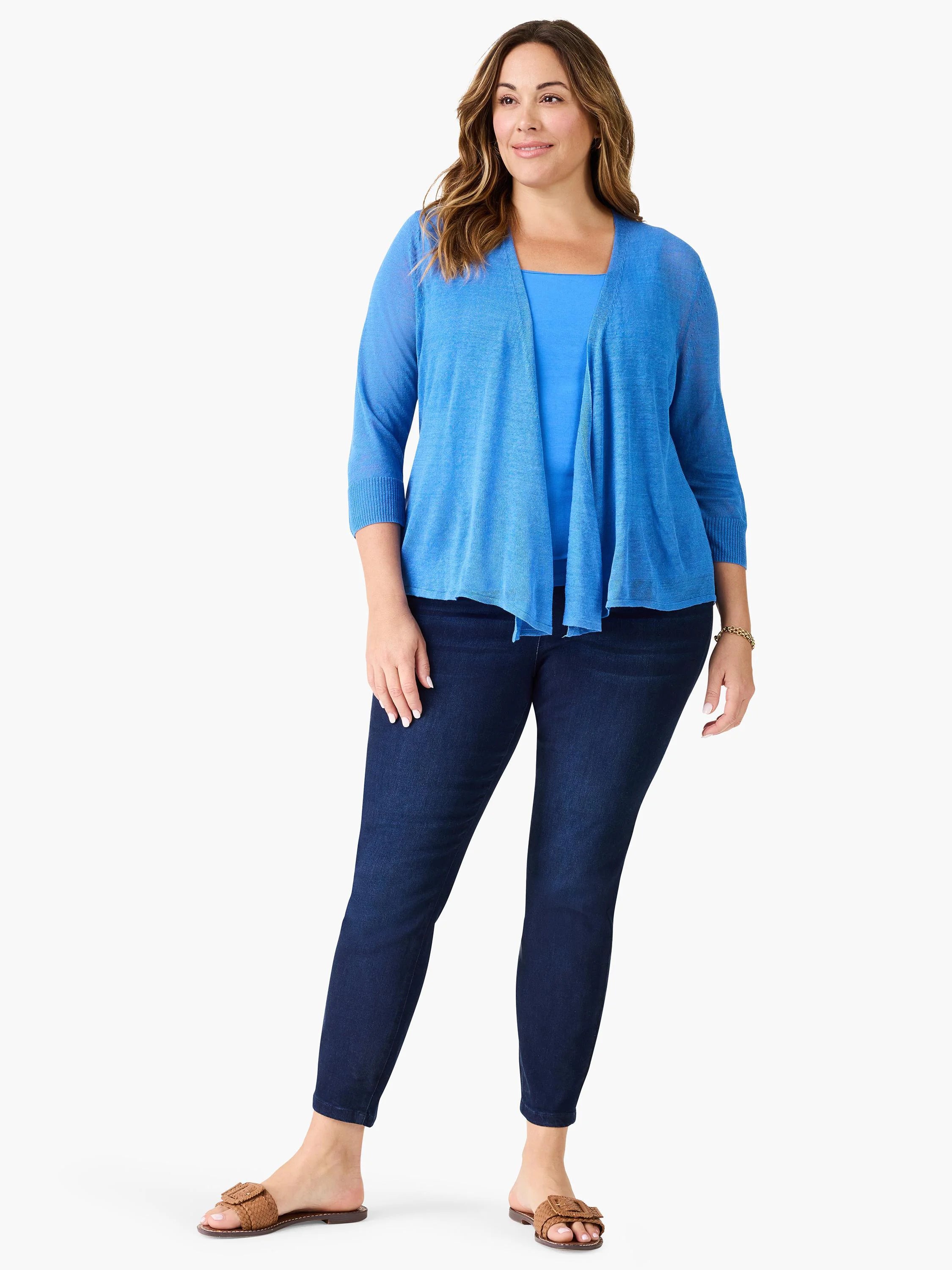 Blue square neck tank top on a model, featuring wide straps and a smooth, medium blue fabric.