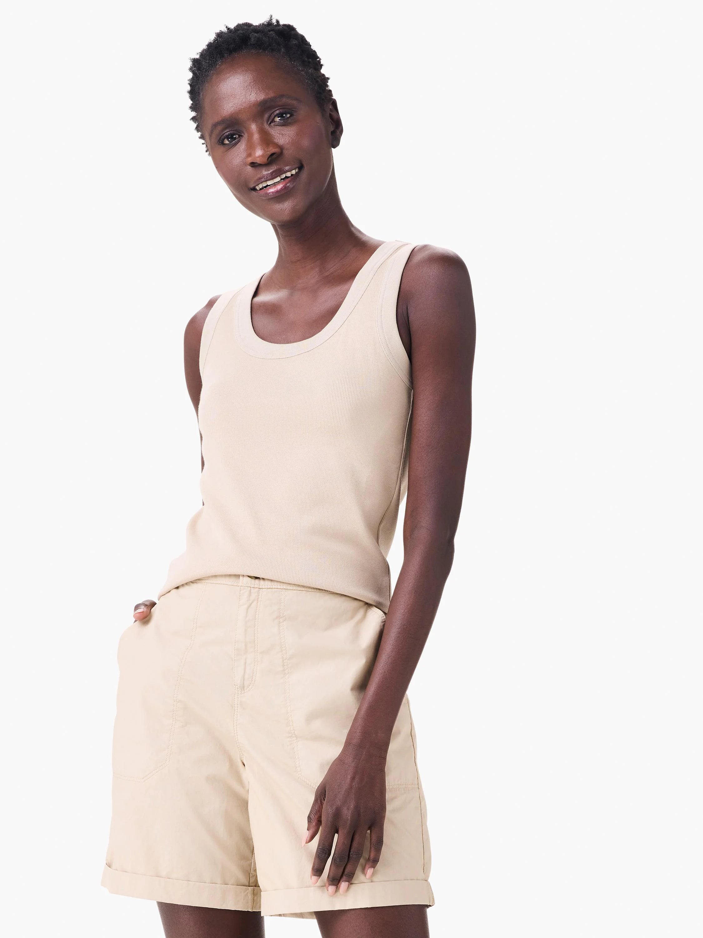 Beige knit ribbed scoop tank on a model.