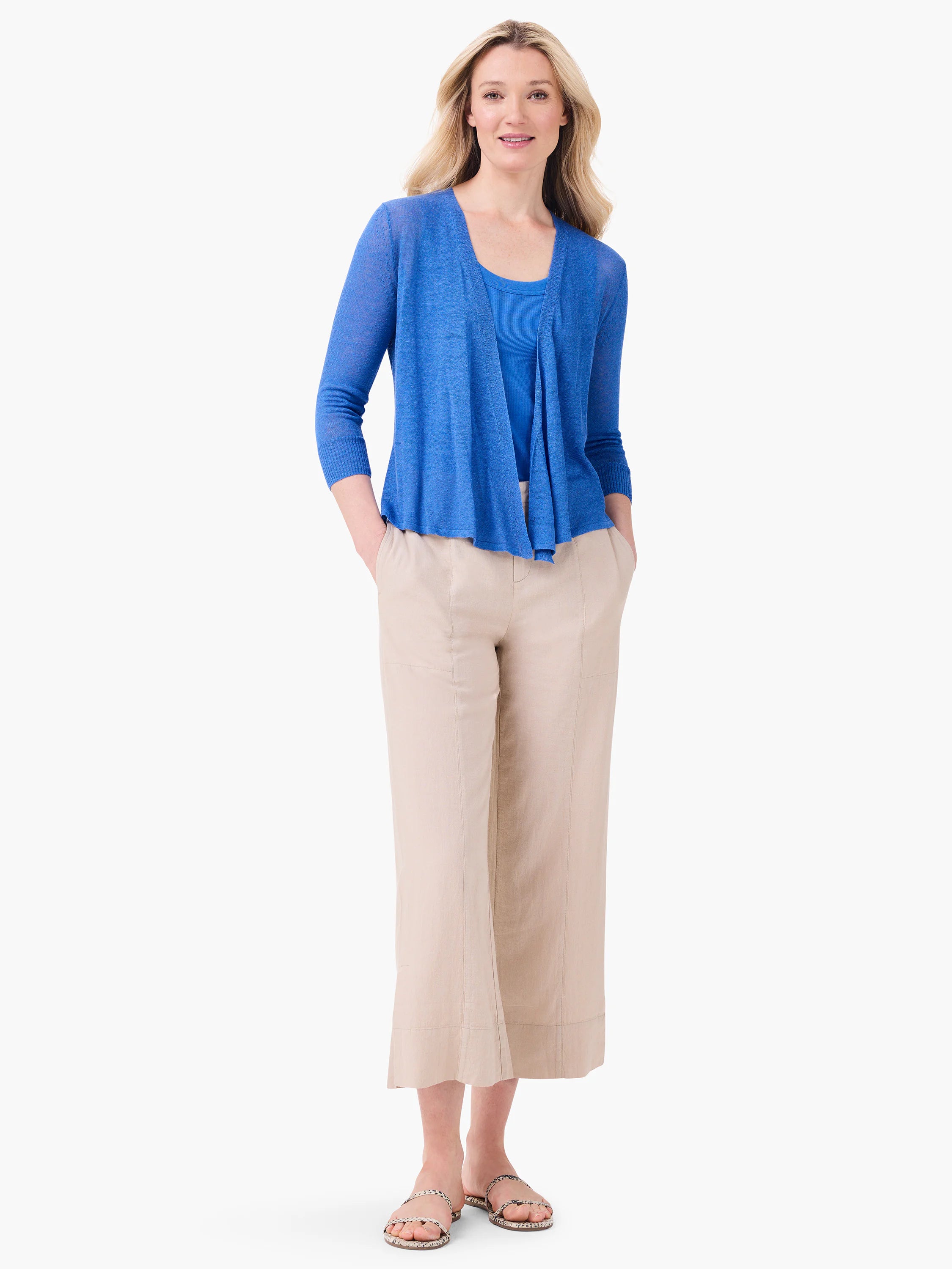 Blue ribbed knit scoop tank on model.