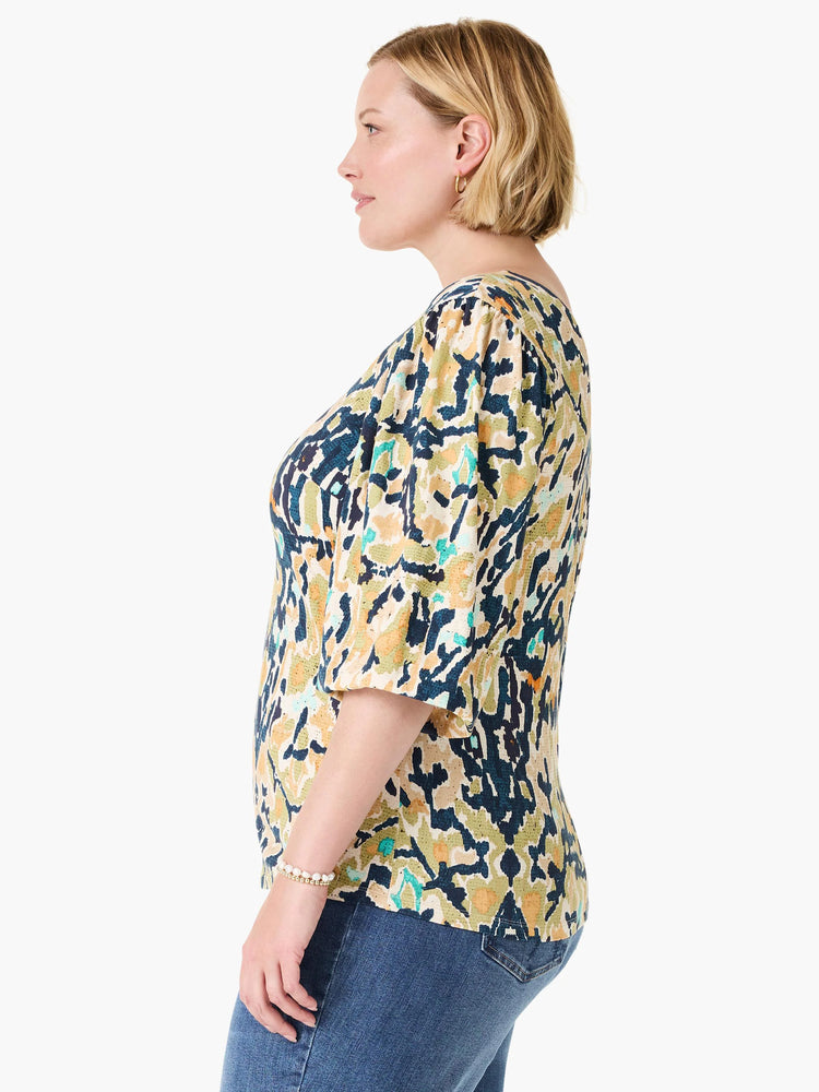 Vineyard Glow Top, abstract pattern in dark blue, olive green, gold, teal on cream. Elbow-length sleeves.