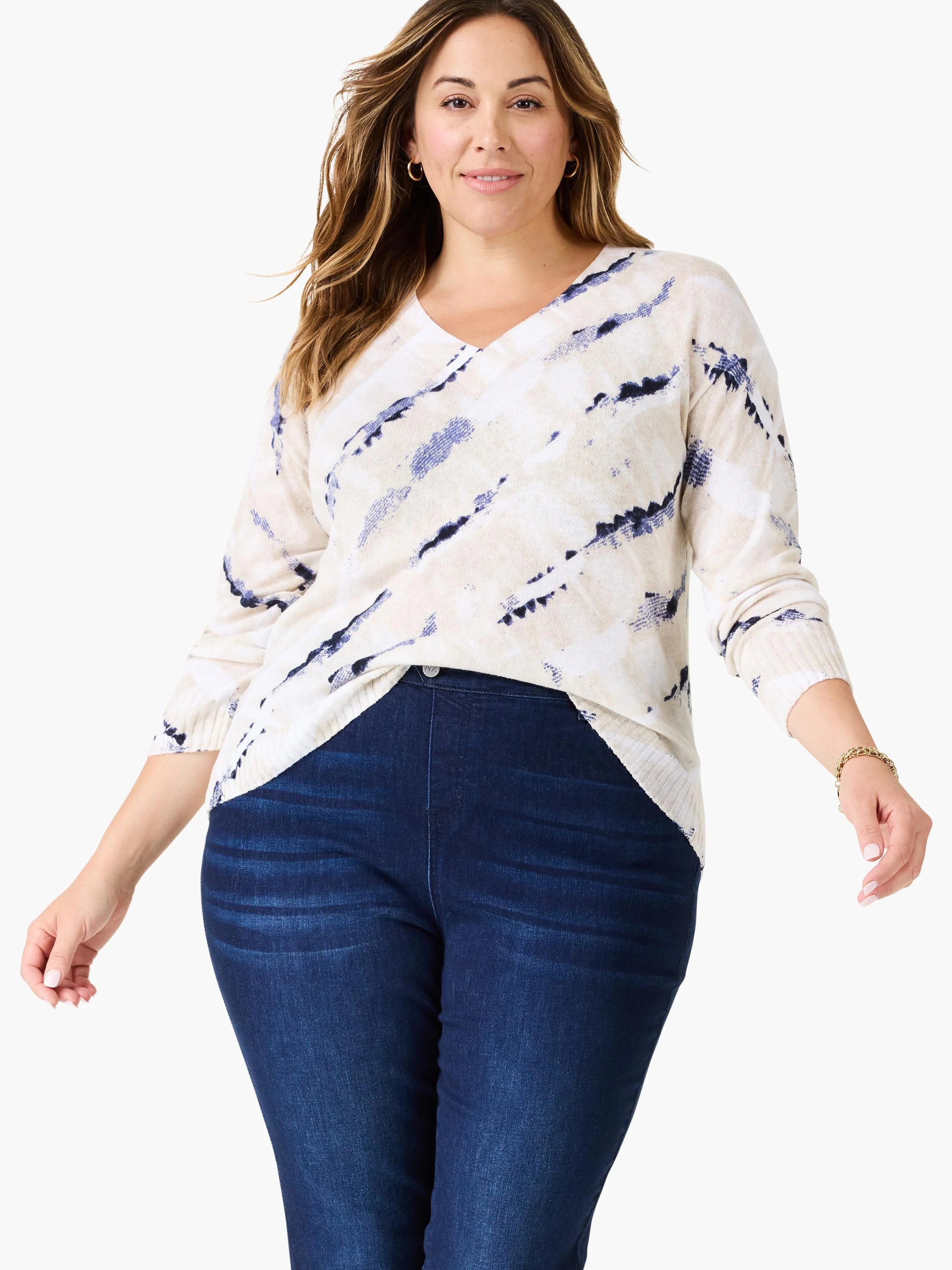Cream V-neck sweater with navy blue tie-dye pattern.