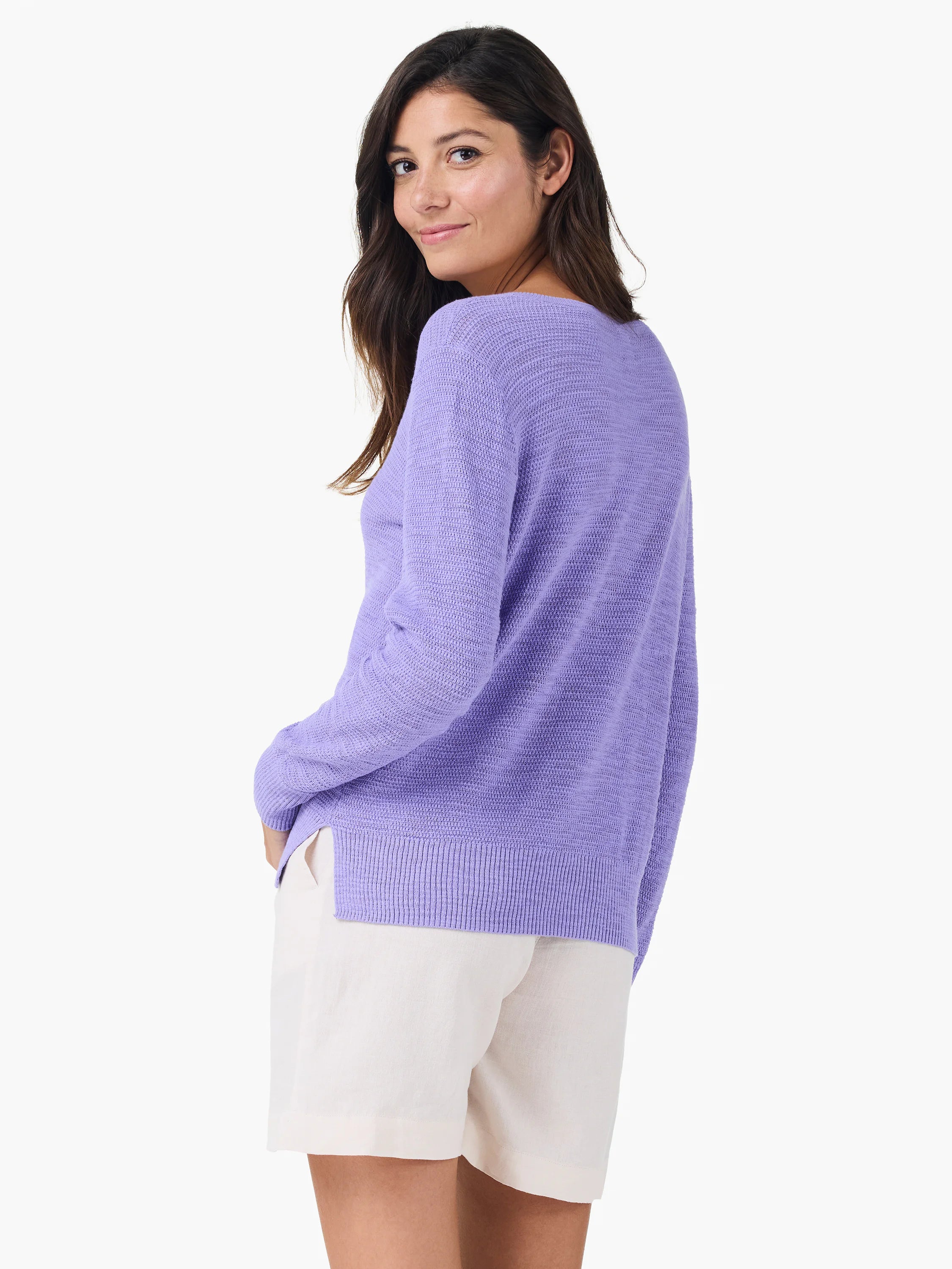 Lavender long-sleeve sweater with a loose textured knit, ribbed hem, and side slits.