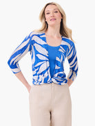 Blue and white organic print cardigan with 3/4 sleeves, tied at the waist.