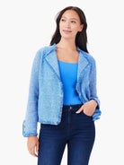 Light blue and white mixed knit jacket with fringe on collar, open front, and cuffs.