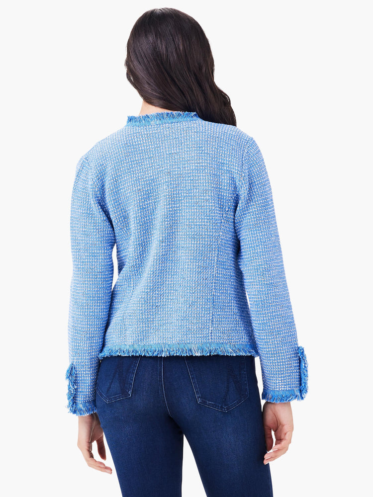 Blue and white mixed knit jacket with fringe at the hem, cuffs, and collar.