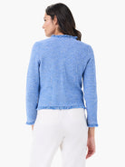 Blue mix knit jacket with fringe trim at collar, cuffs, and hem.