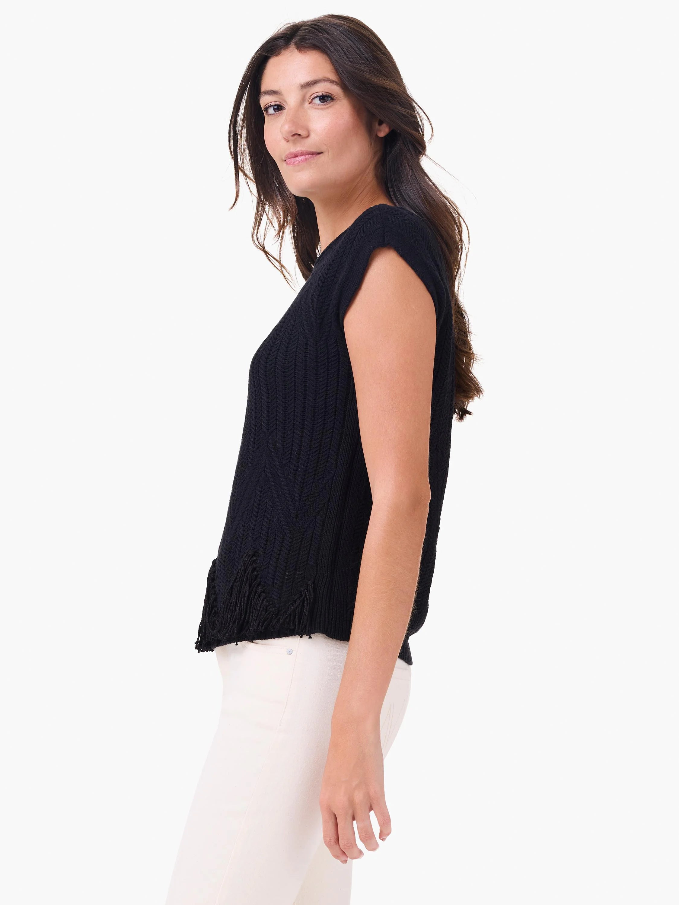 Black sleeveless sweater features a chevron knit texture and fringe hem.
