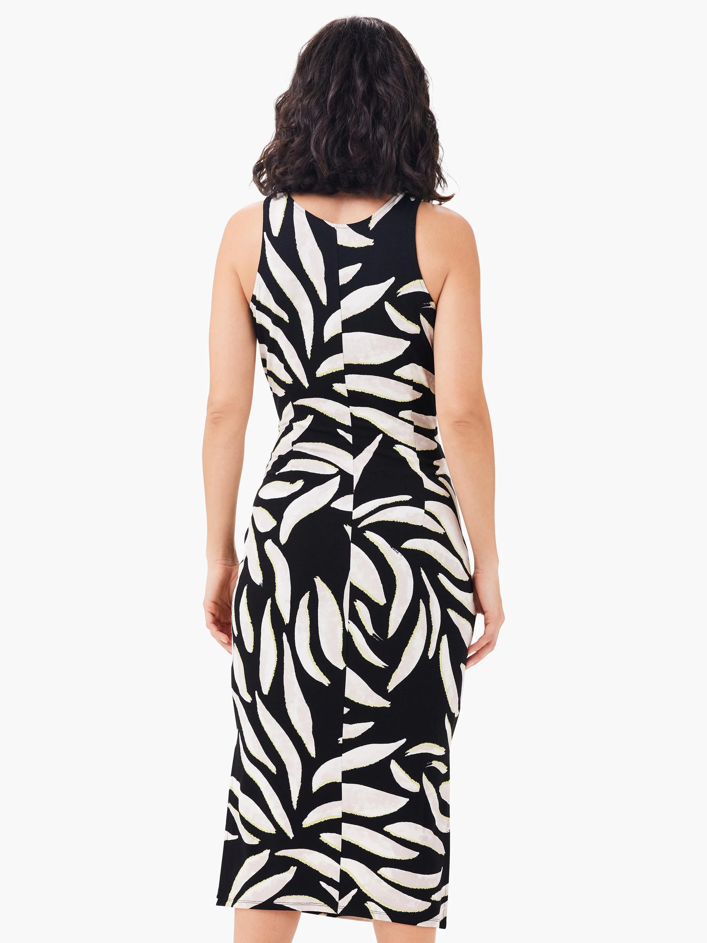 Back view of a sleeveless black dress with an off-white abstract leaf pattern and pale yellow accents.