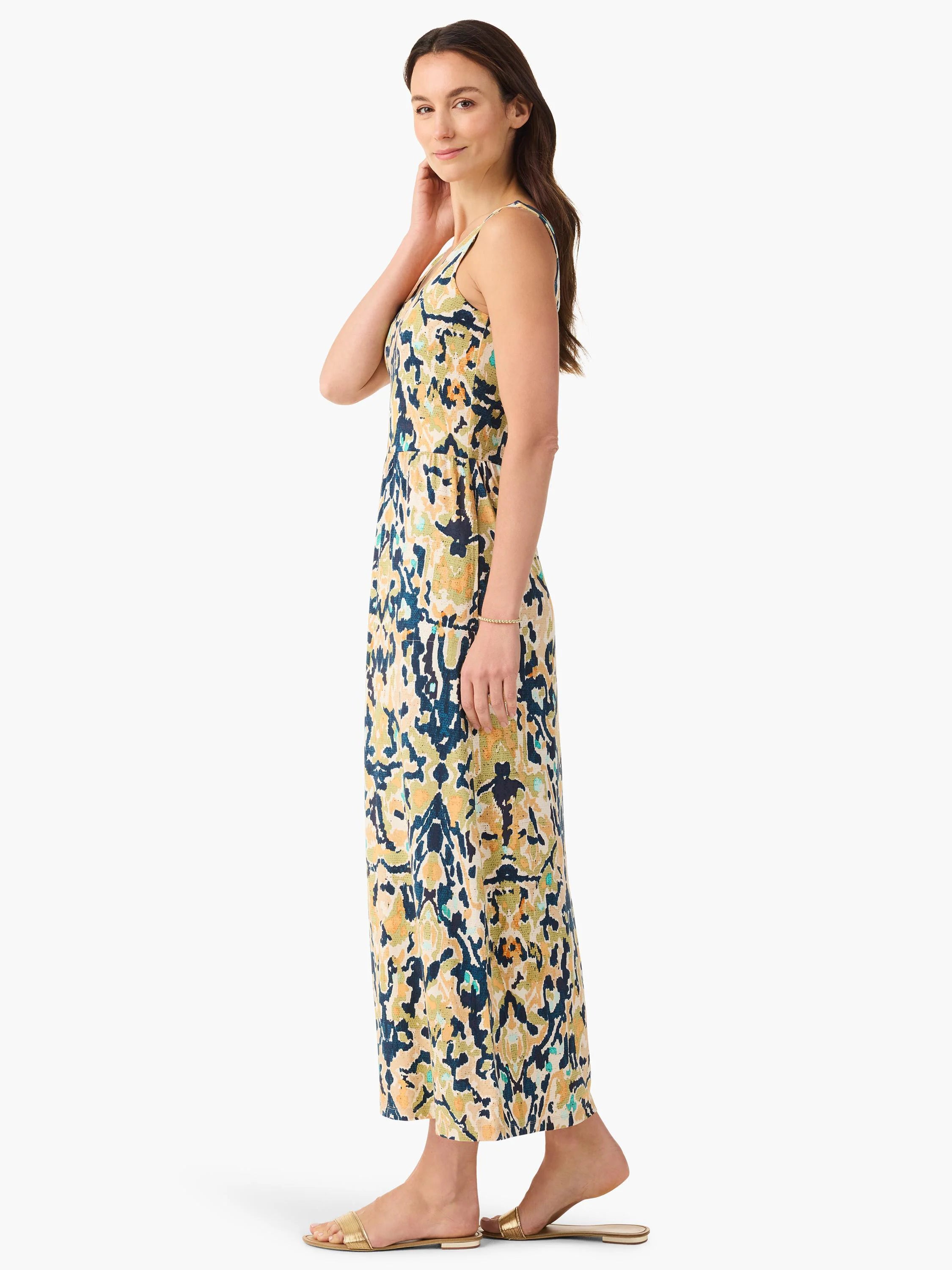Sleeveless maxi dress with abstract cream, navy, golden yellow, and teal pattern.