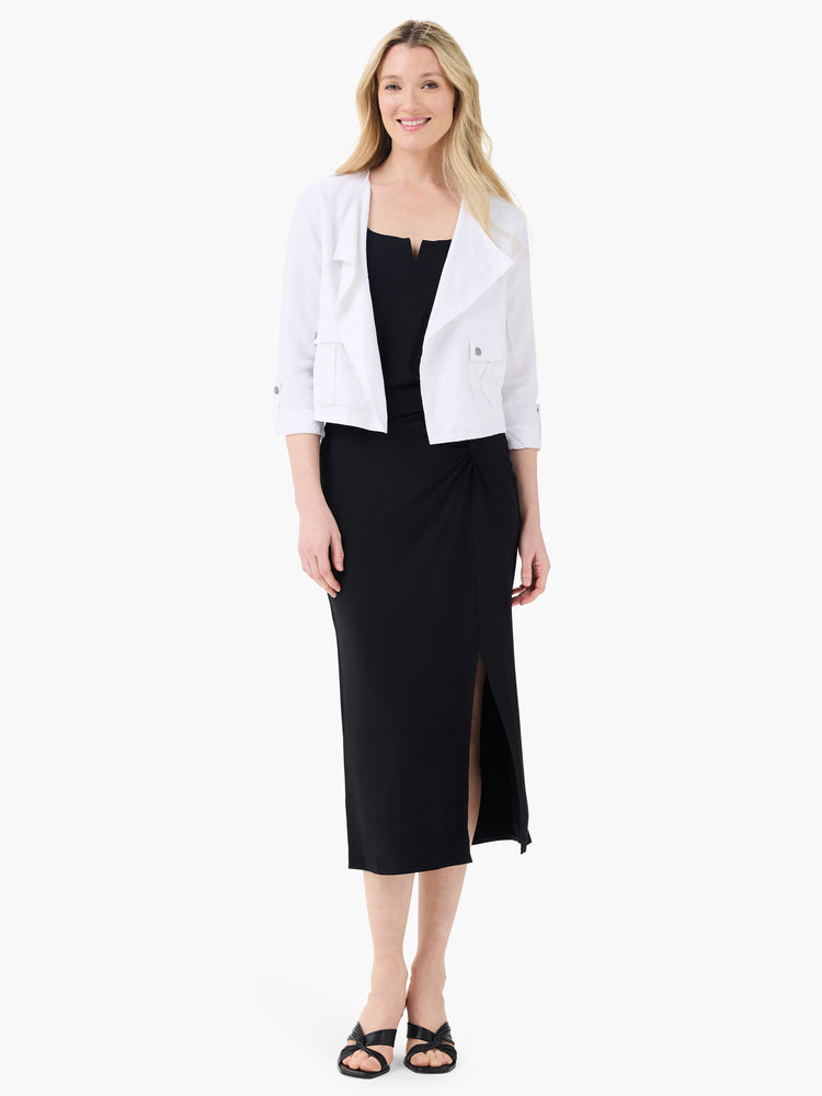 Black jersey sarong skirt, midi length, with a side knot and slit.