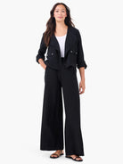 Black linen moto jacket. Cropped, open style with draped lapels, two chest patch pockets (silver snaps), and cuffed 3/4...