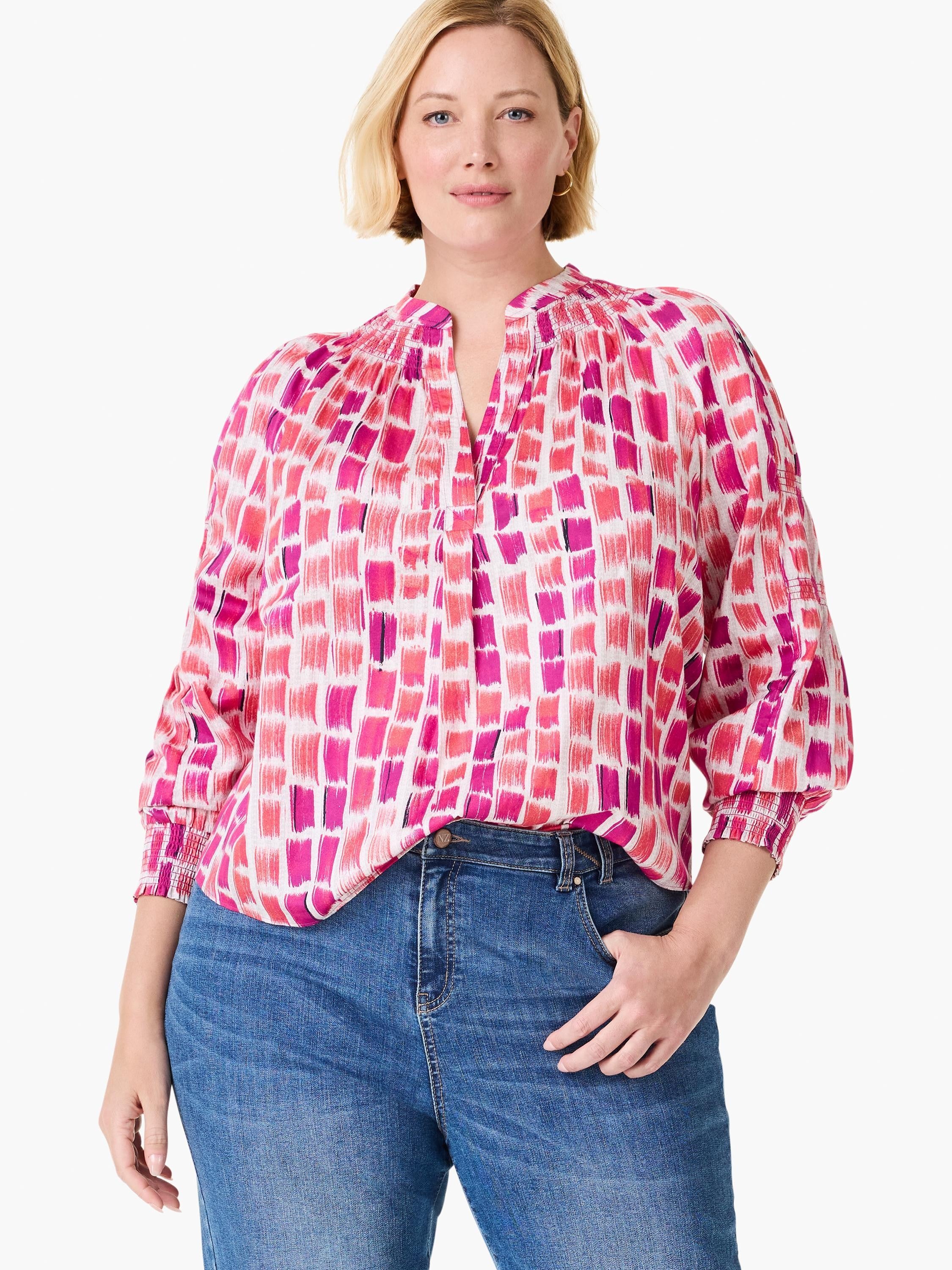 White top with abstract pink and fuchsia brushstrokes. Features V-neck, gathered collar, and 3/4 smocked sleeves.