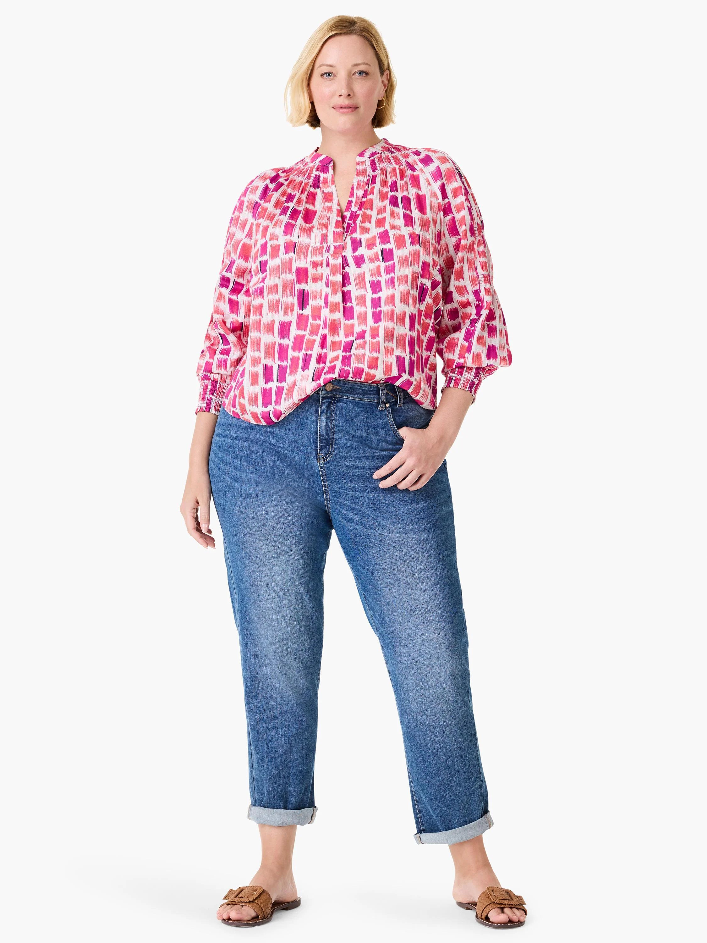 White top with multi-tone pink brushstroke pattern, split neck, and smocked 3/4 sleeves.