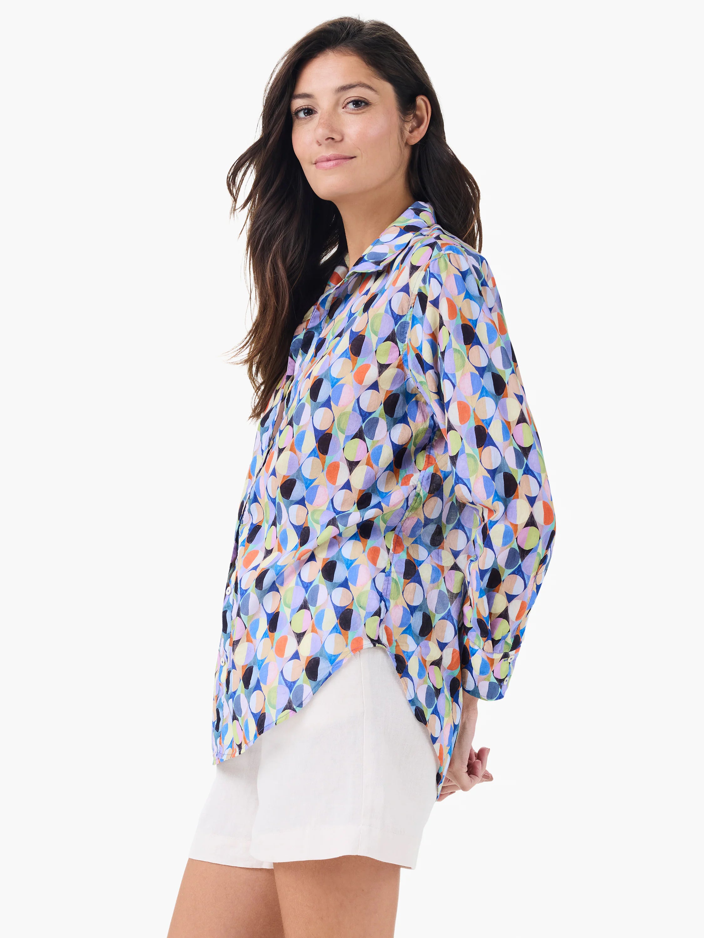 Loose-fitting boyfriend shirt with a vibrant, abstract pattern of multi-colored interlocking circles.