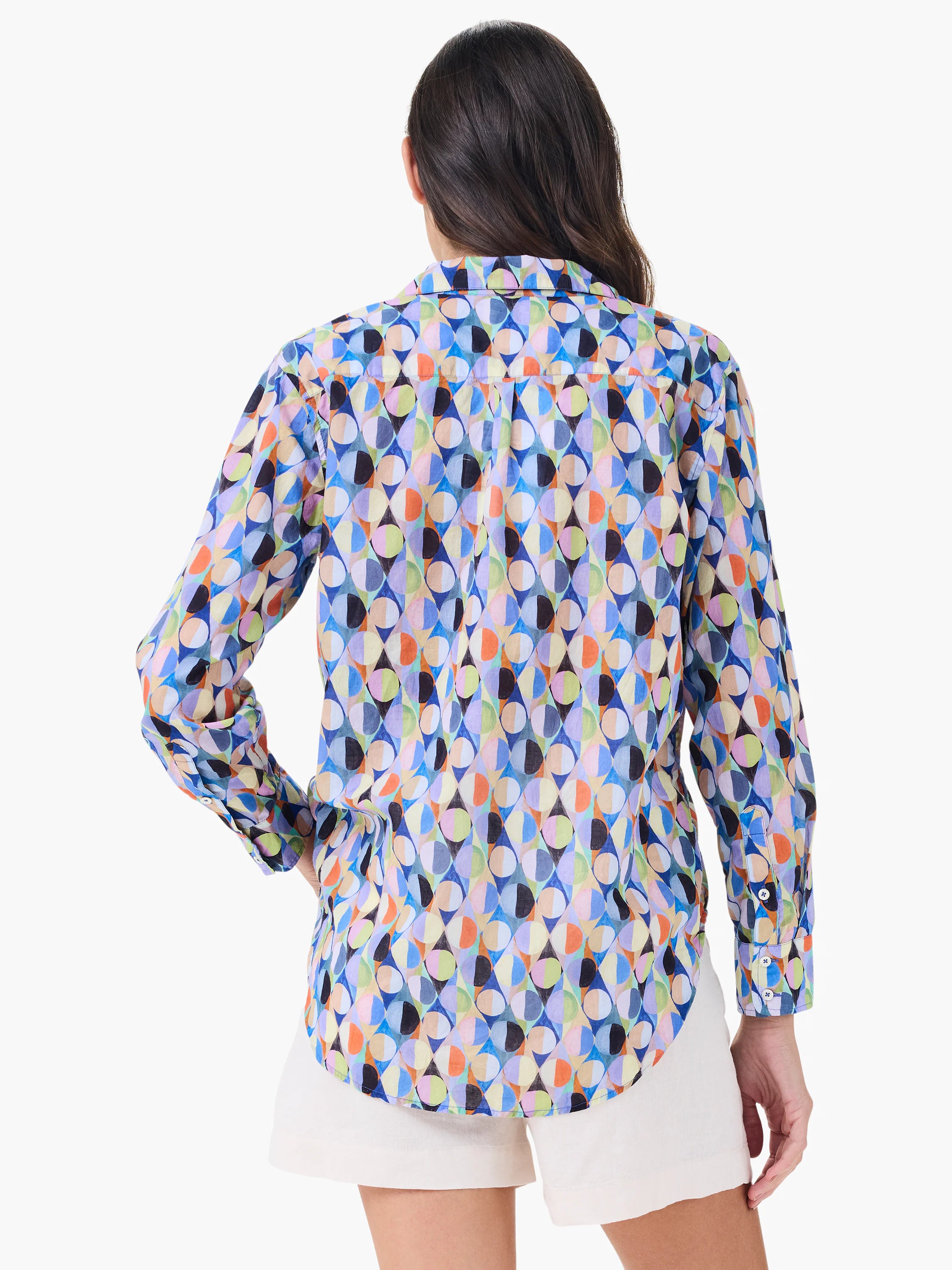 Long-sleeve shirt in a multicolor, geometric pattern of circles & diamonds. Features blues, oranges, purples, black.