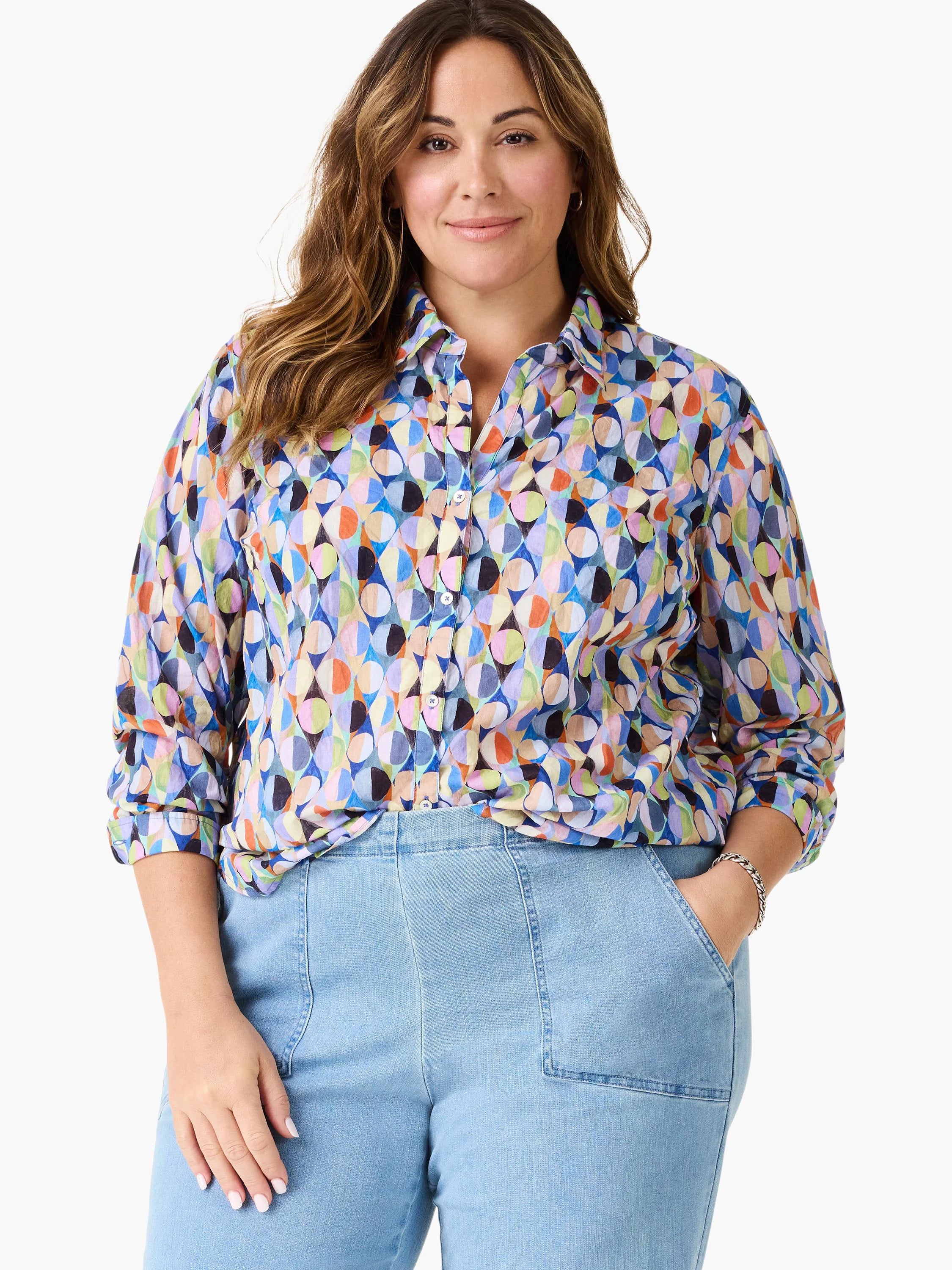 Multicolor button-up shirt with a vibrant geometric pattern of overlapping circles in various shades. Sleeves rolled.