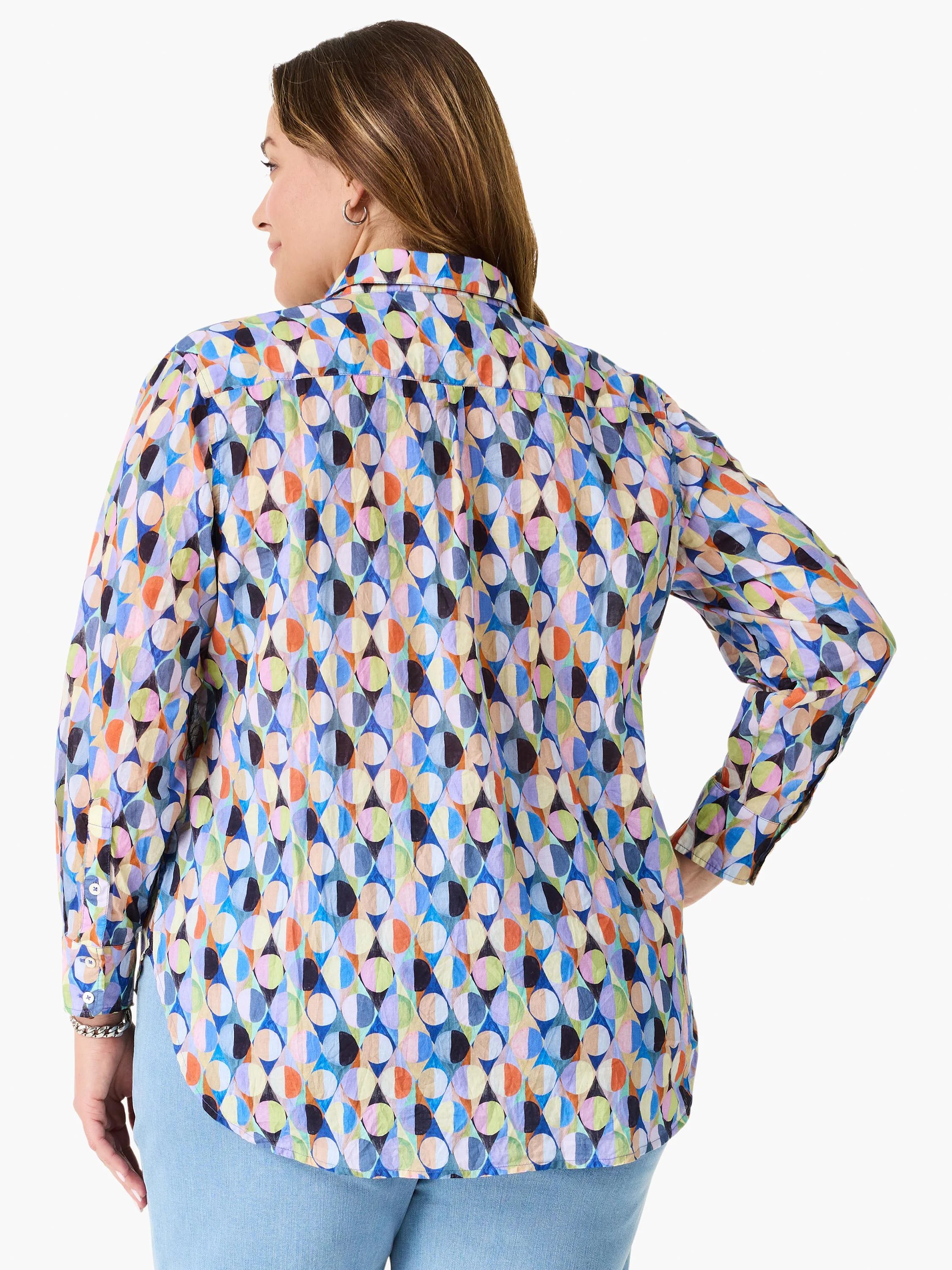 Relaxed fit shirt with an abstract pattern of segmented circles in bright blues, greens, oranges, pinks, purples, and black.