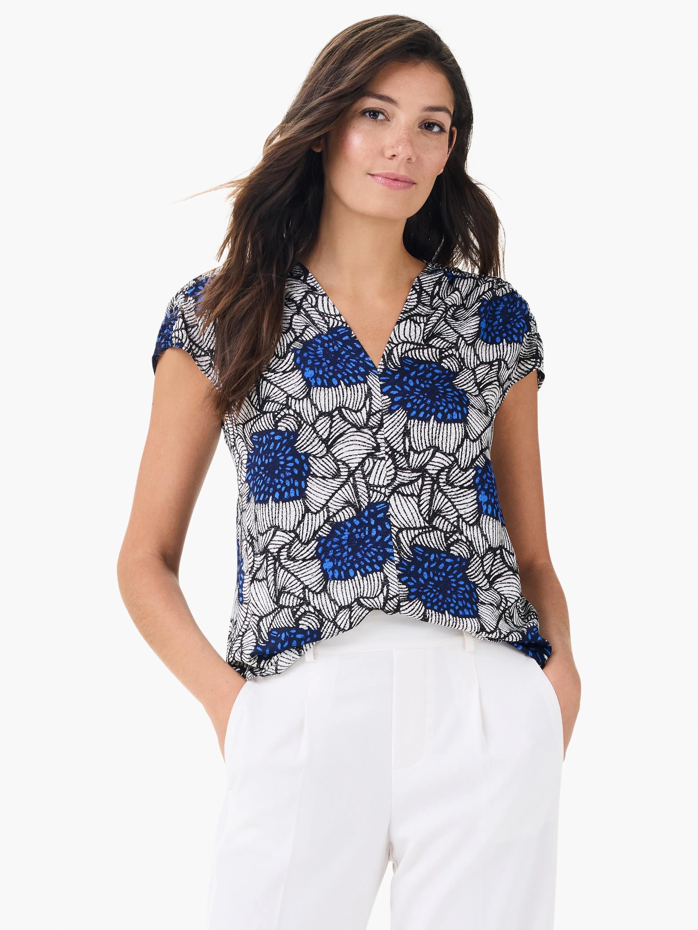 Blue, white, and black floral print V-neck top with cap sleeves.