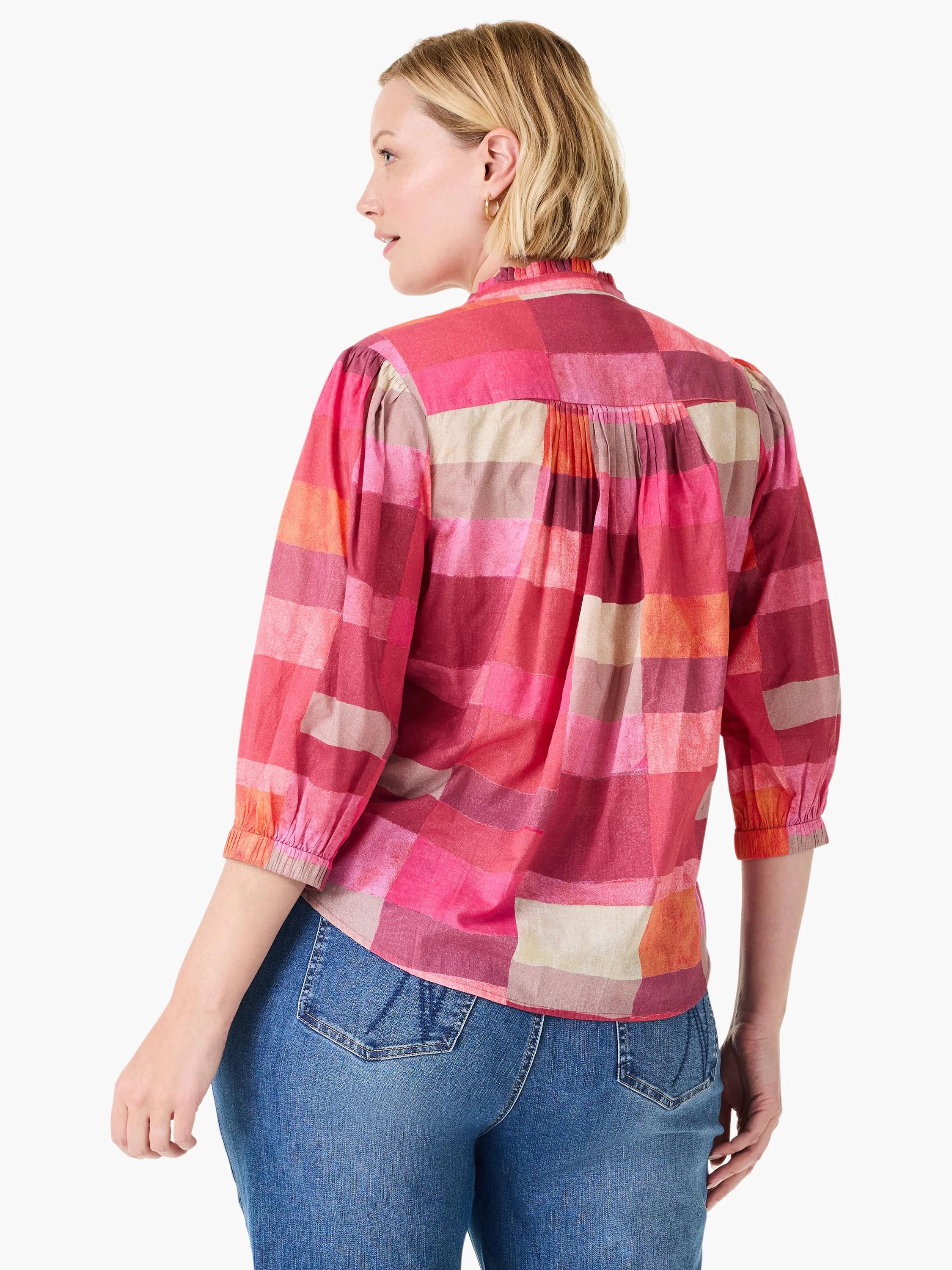 Plaid shirt in pink, red, orange, and beige. Ruffled collar, gathered shoulders, 3/4 length elastic cuffs.