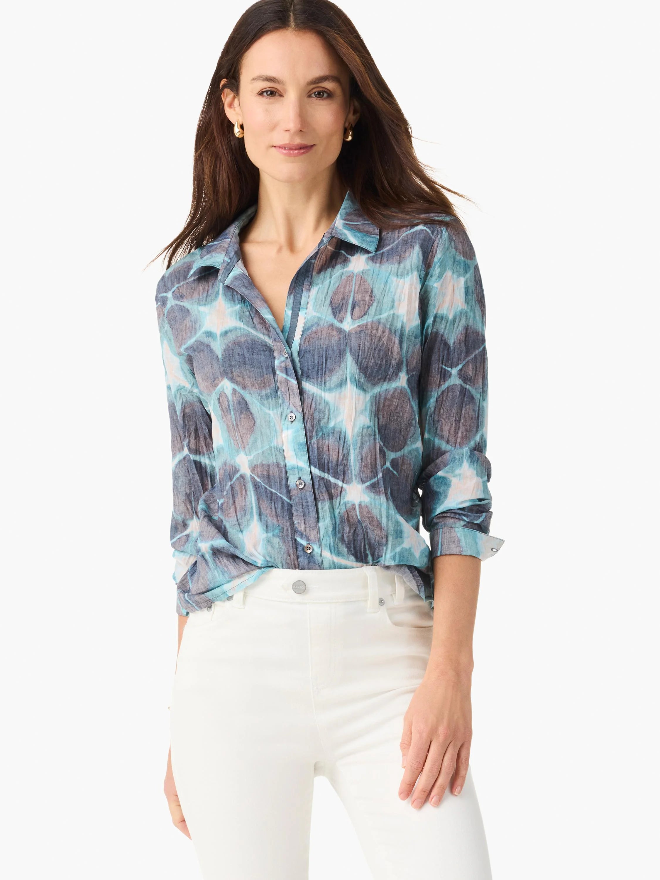 Crinkled shirt: fluid blue, teal, & white tie-dye pattern with darker spots. Long-sleeved, button-front.
