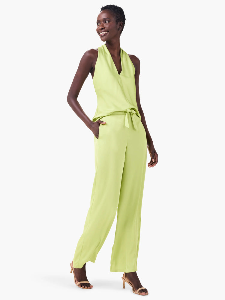 Lime green crepe halter top with a V-neck and flowing drape.