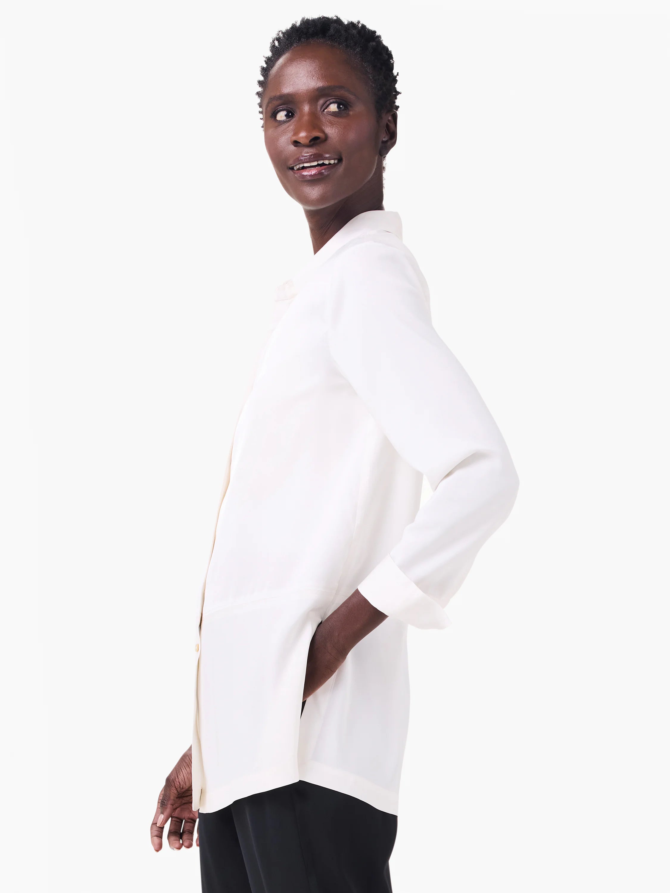 Softly draped off-white collared shirt with cuffed long sleeves and a side pocket.